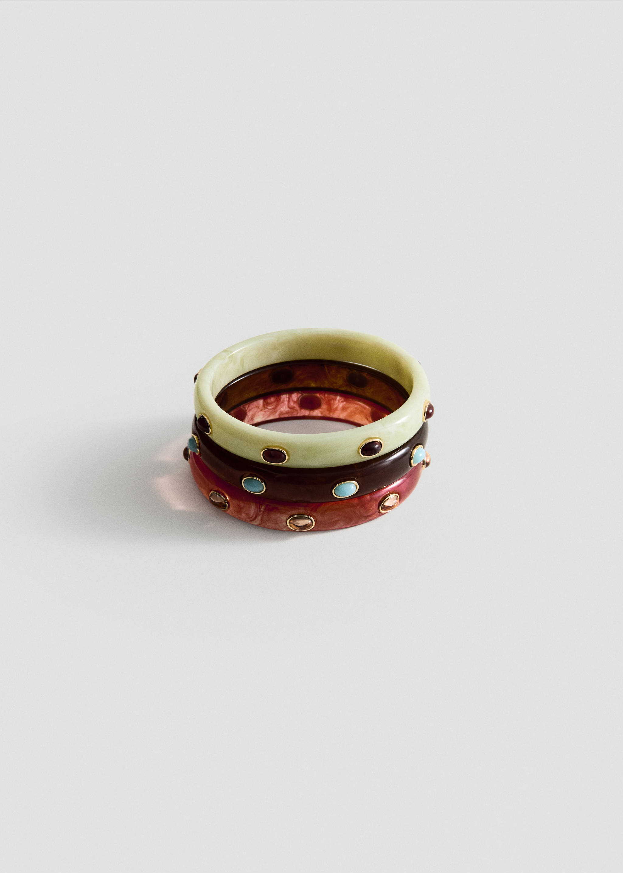 Set of three resin bangles in pale green, dark brown, and reddish-pink, inlaid with decorative stones., Brown. Ref: 27057790-00.