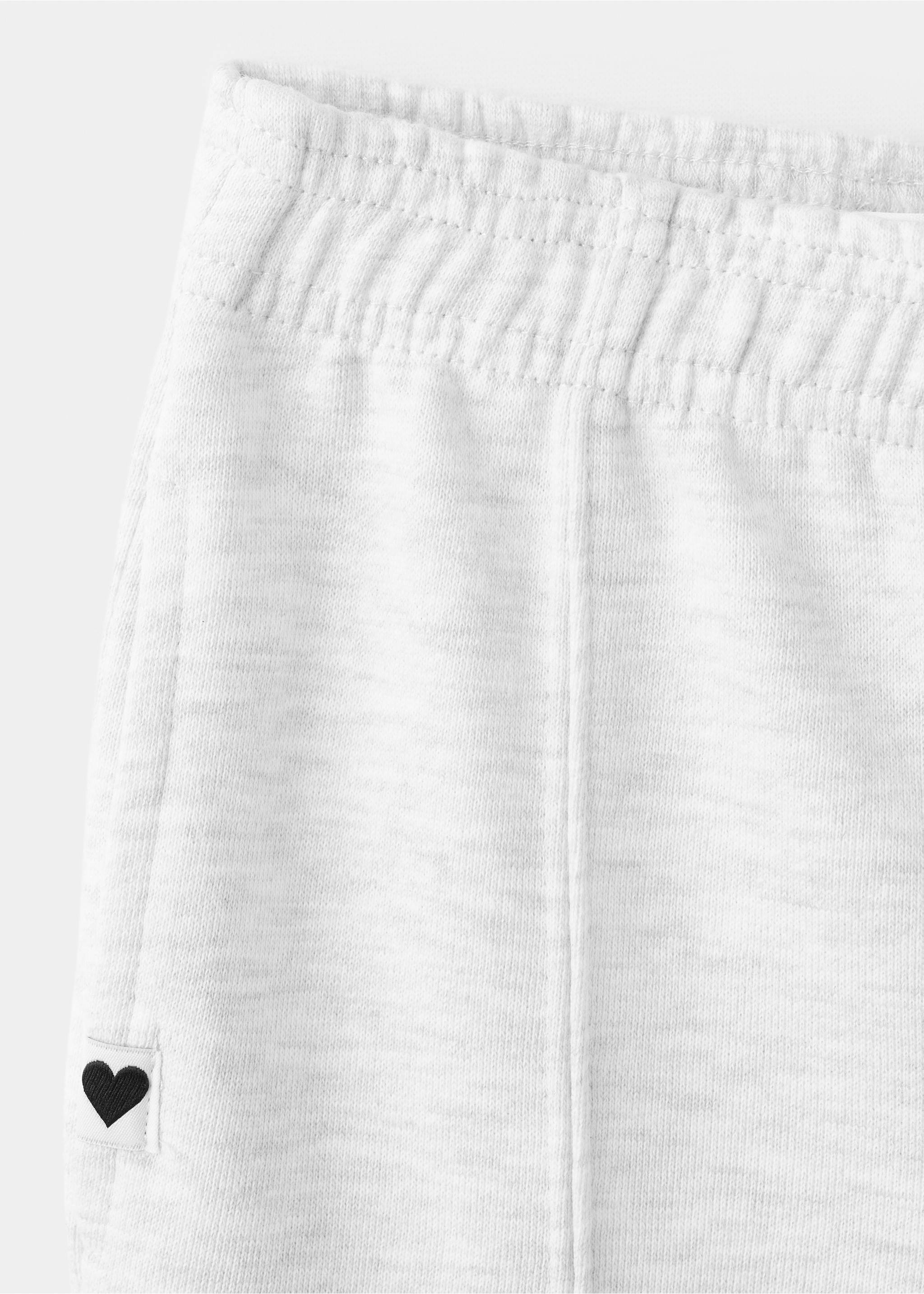 Detail of white heathered kids' joggers showing the elasticated waistband., Light Heather Grey. Ref: 27061269-00.