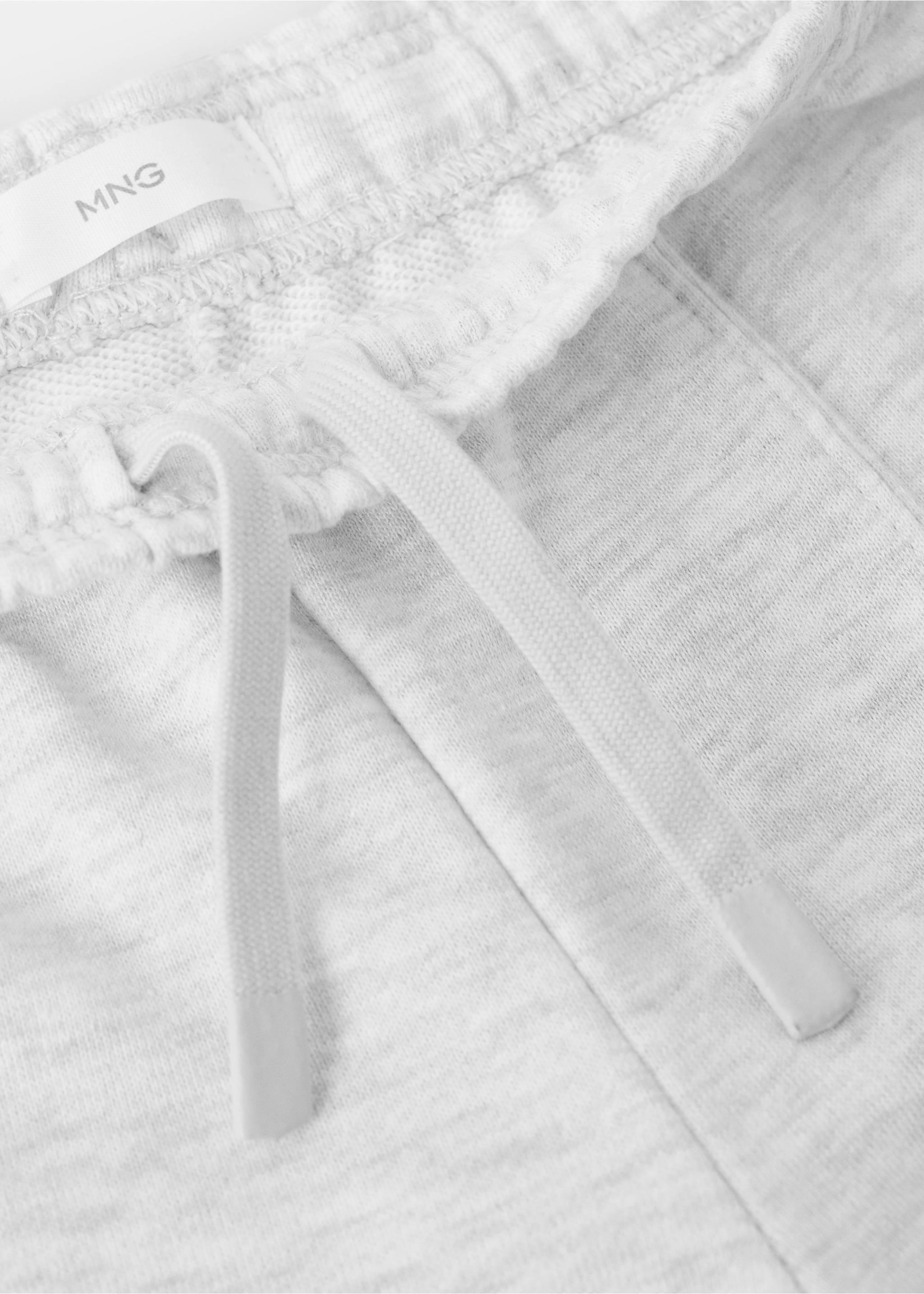Close-up of light grey marl joggers showing the elasticated drawstring waistband., Light Heather Grey. Ref: 27061269-00.