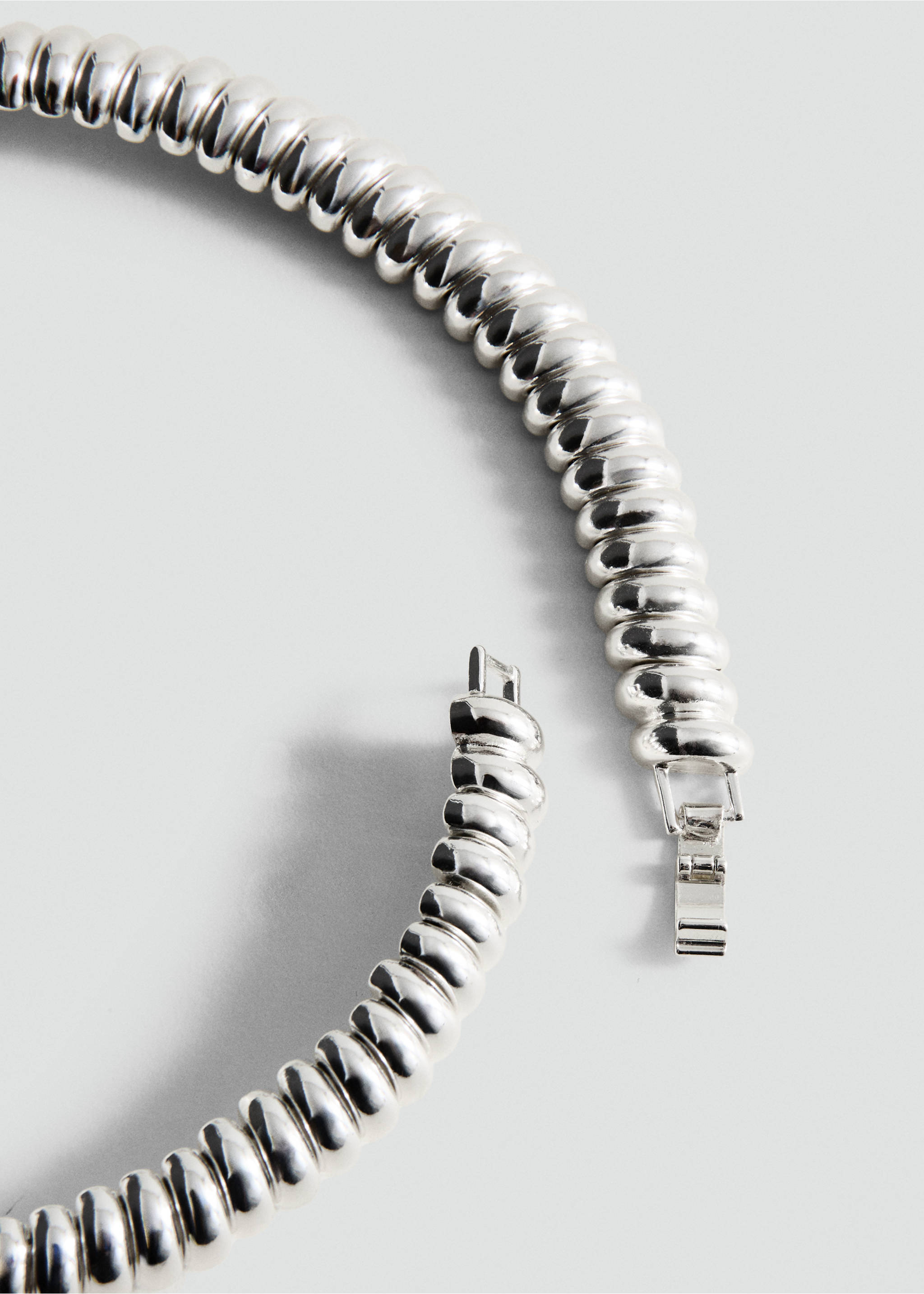 Silver-toned metallic collar necklace with a ridged, segmented design., Silver. Ref: 27061318-00.