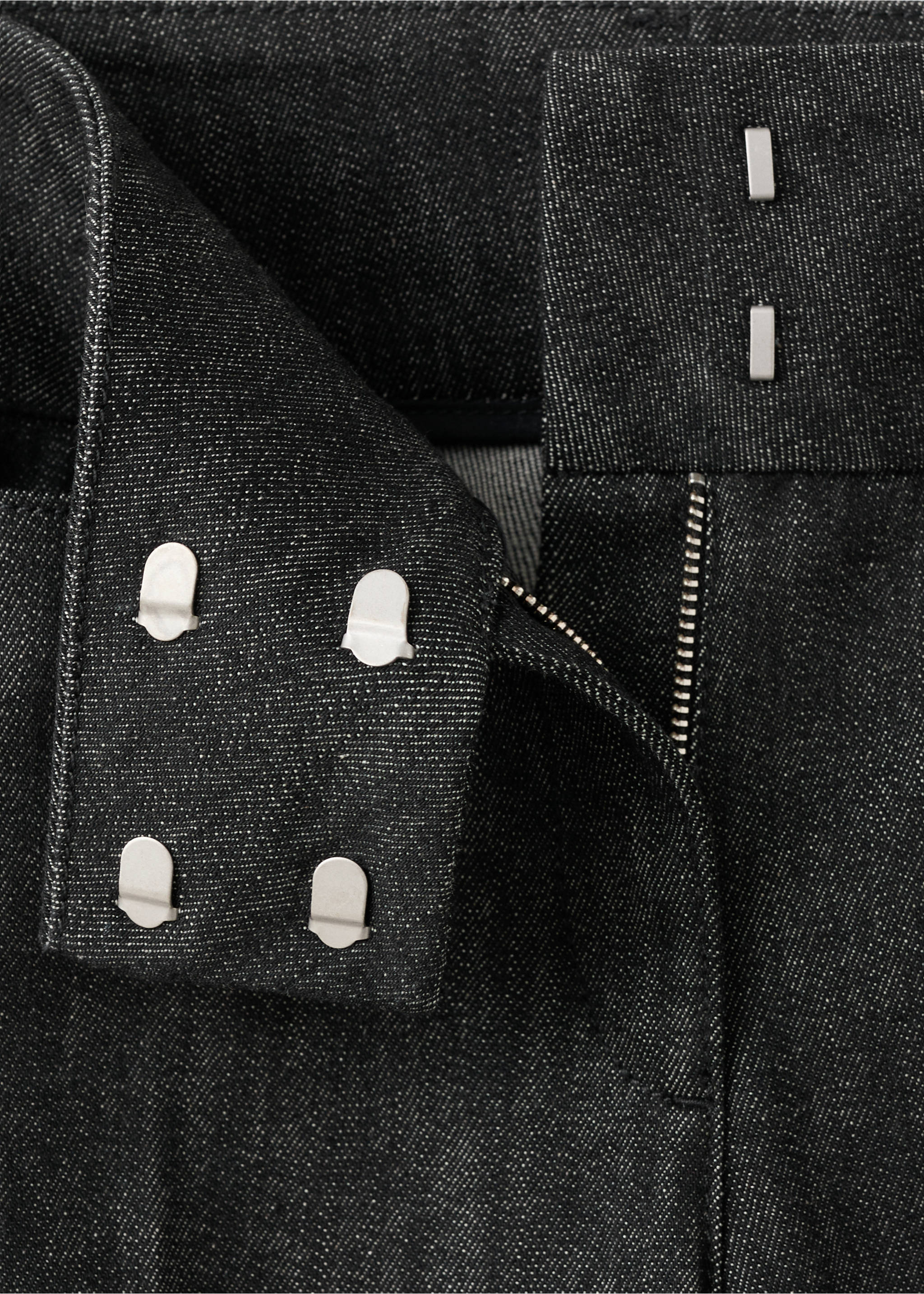 Close-up of dark grey denim trousers waistband and hook-and-bar fastening., Black. Ref: 27063329-00.