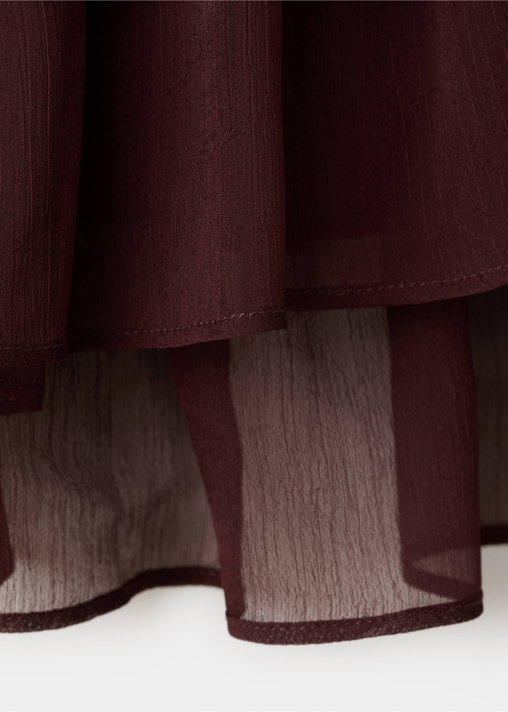 Close-up of dark burgundy blouse fabric showing sheer textured layers., Chocolate. Ref: 27067160-00.