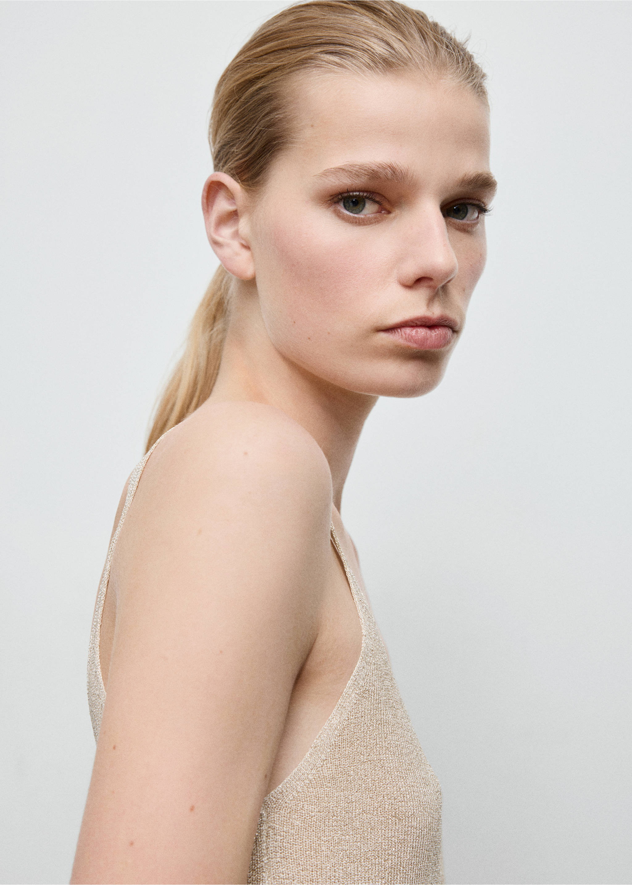 Lurex knitted V-neck top - Details of the article 1, Gold. Ref: 27071265-00.