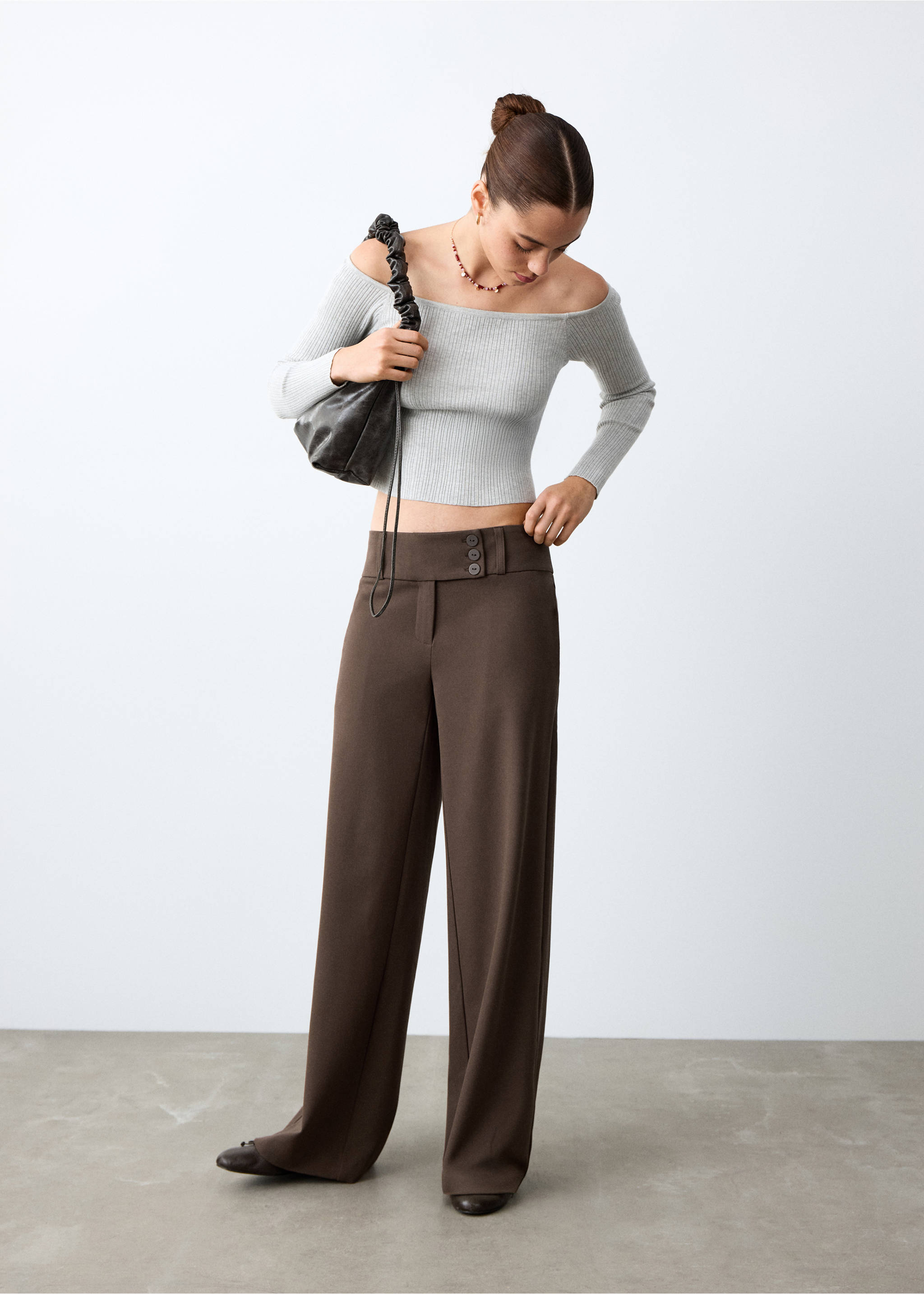 Brown wide-leg trousers with a three-button waistband, styled with a grey ribbed top., Brown. Ref: 27071539-00.