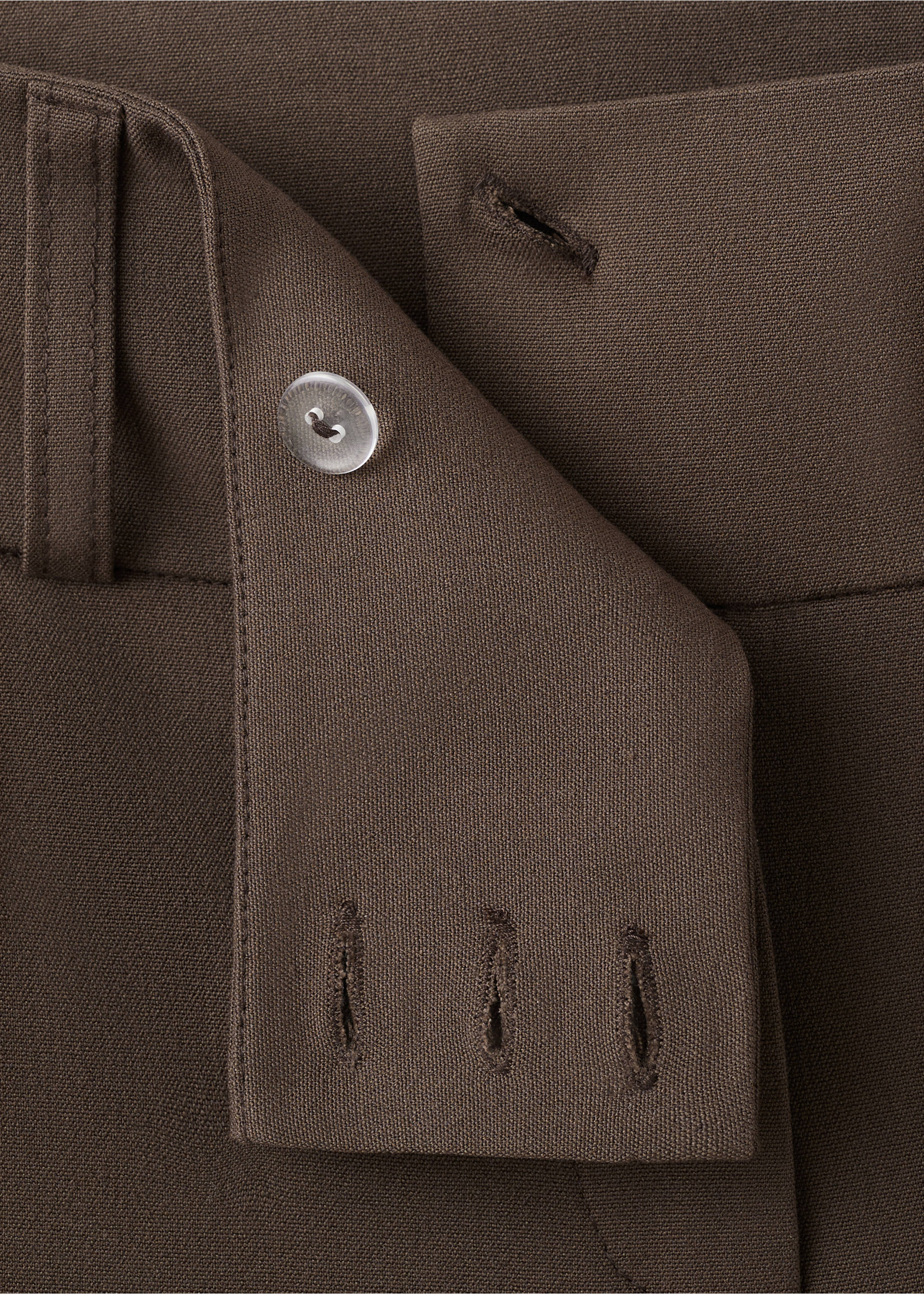 Close-up of brown trousers waistband with button detail, Brown. Ref: 27071539-00.