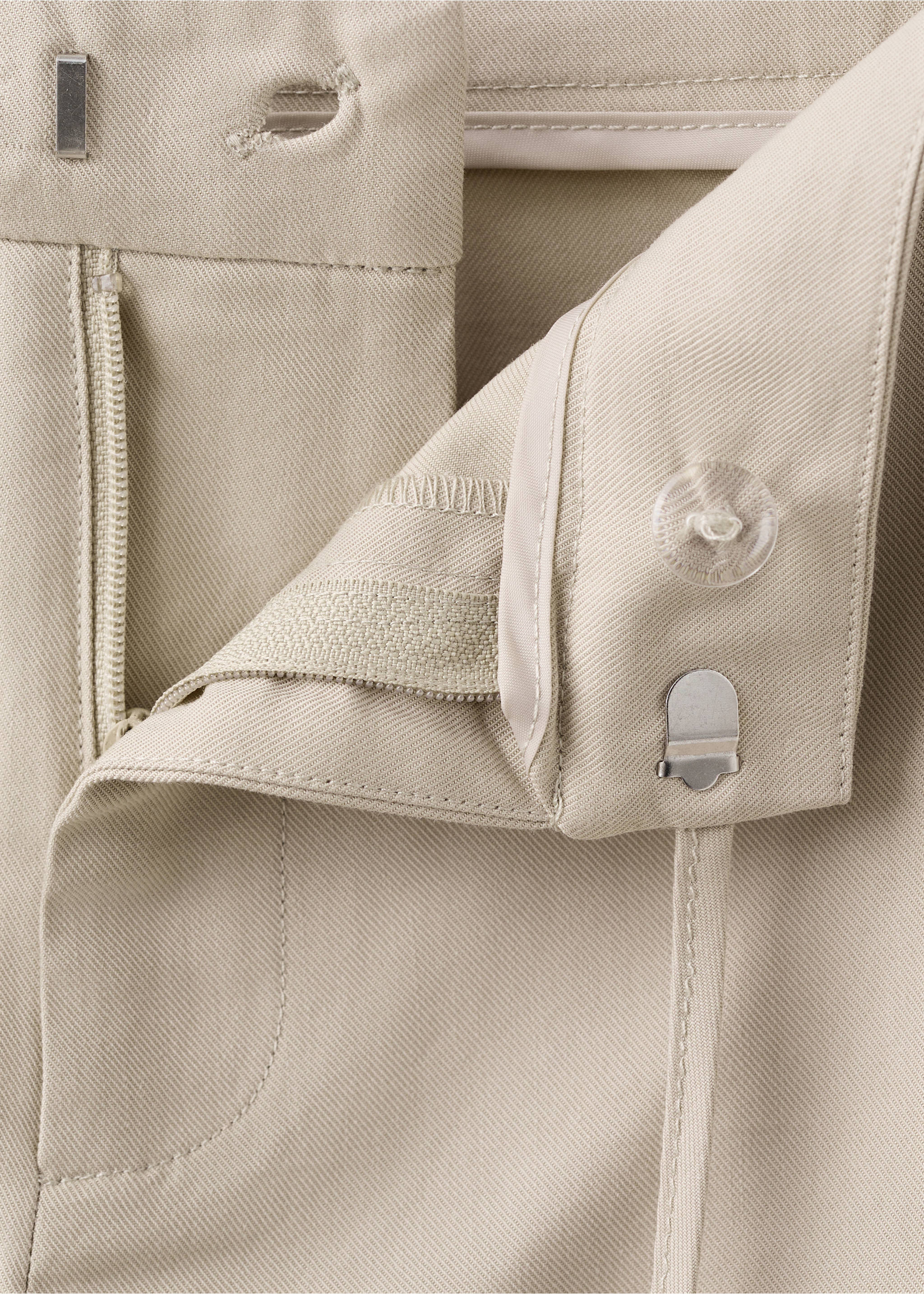 Close-up of beige trousers waistband with hook-and-eye and zip closure., Beige. Ref: 27072549-00.