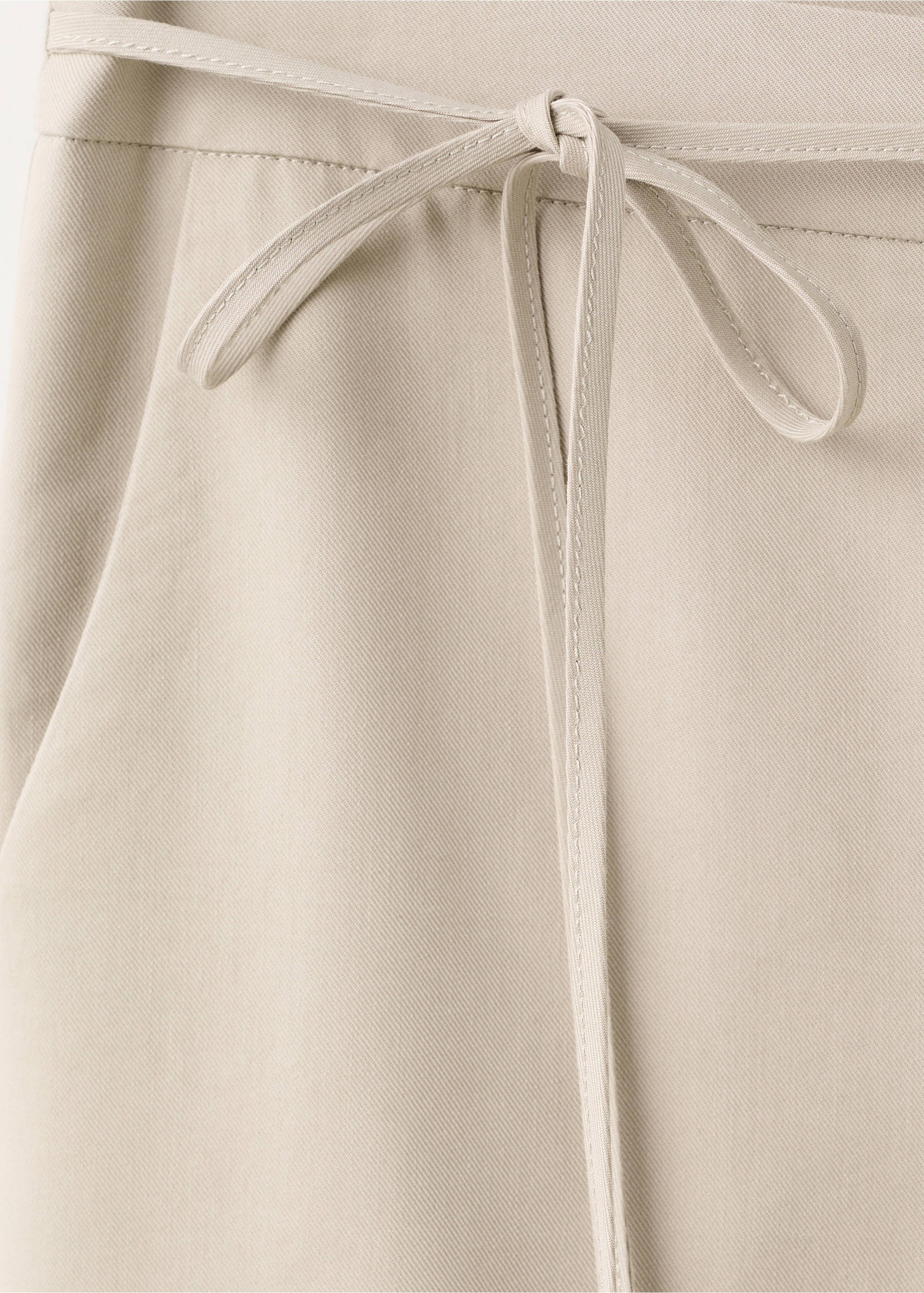 Close-up of light beige trousers with a tied waist belt., Beige. Ref: 27072549-00.