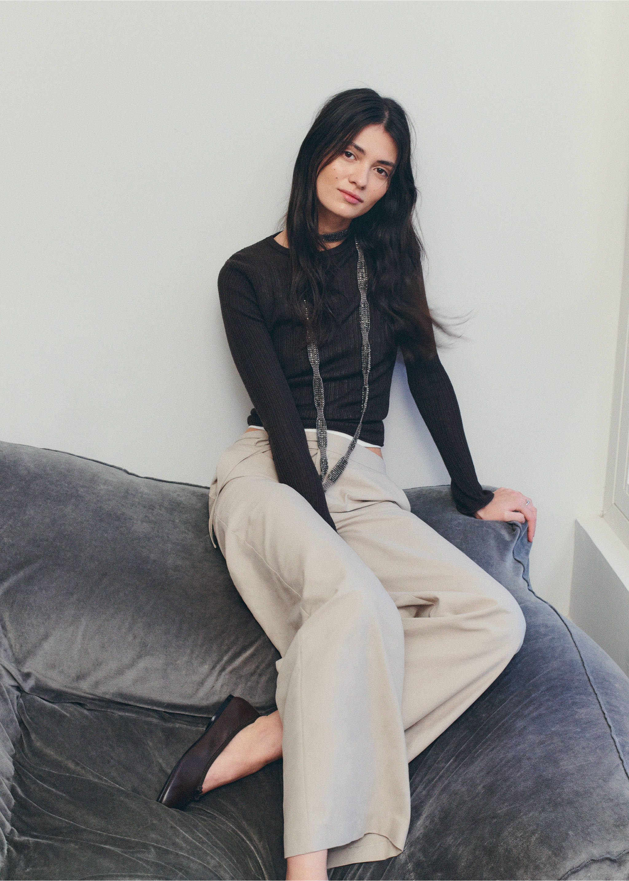 Light beige relaxed-fit trousers worn with a dark brown long-sleeved top., Beige. Ref: 27072549-00.