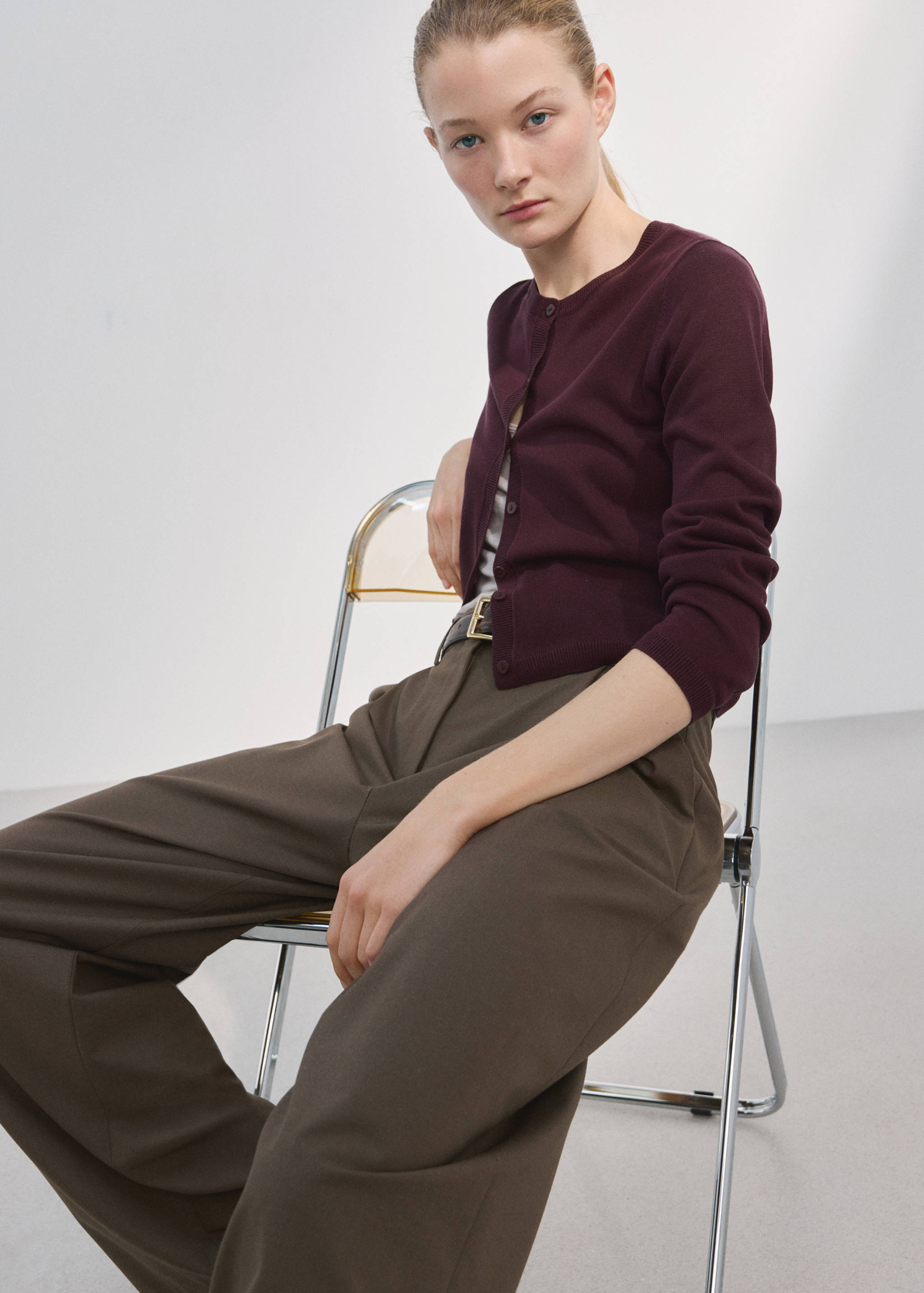 Dark plum cardigan with round neckline and button fastening.