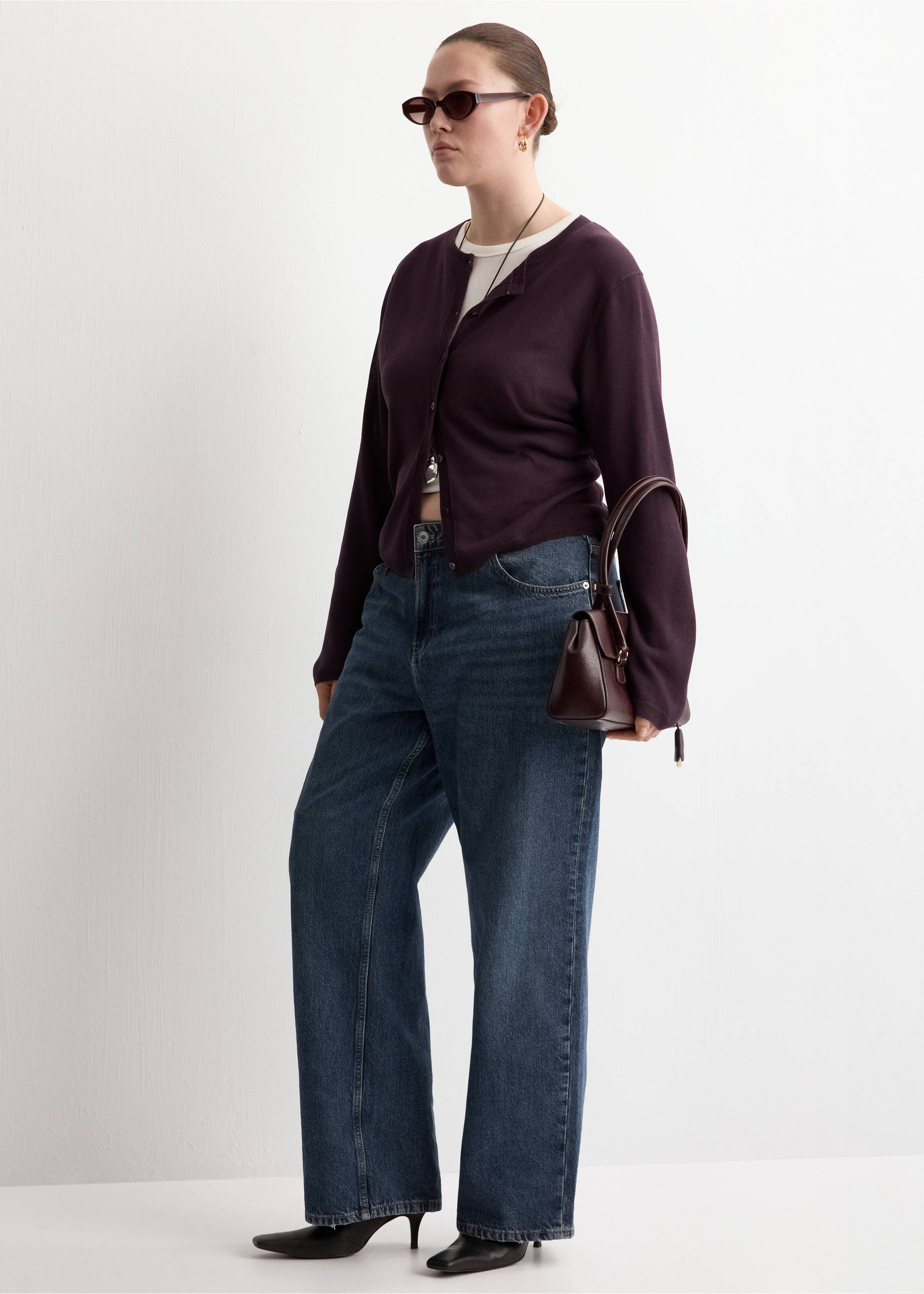 Plum purple crew neck cardigan worn with blue denim trousers., Wine. Ref: 27075819-00.