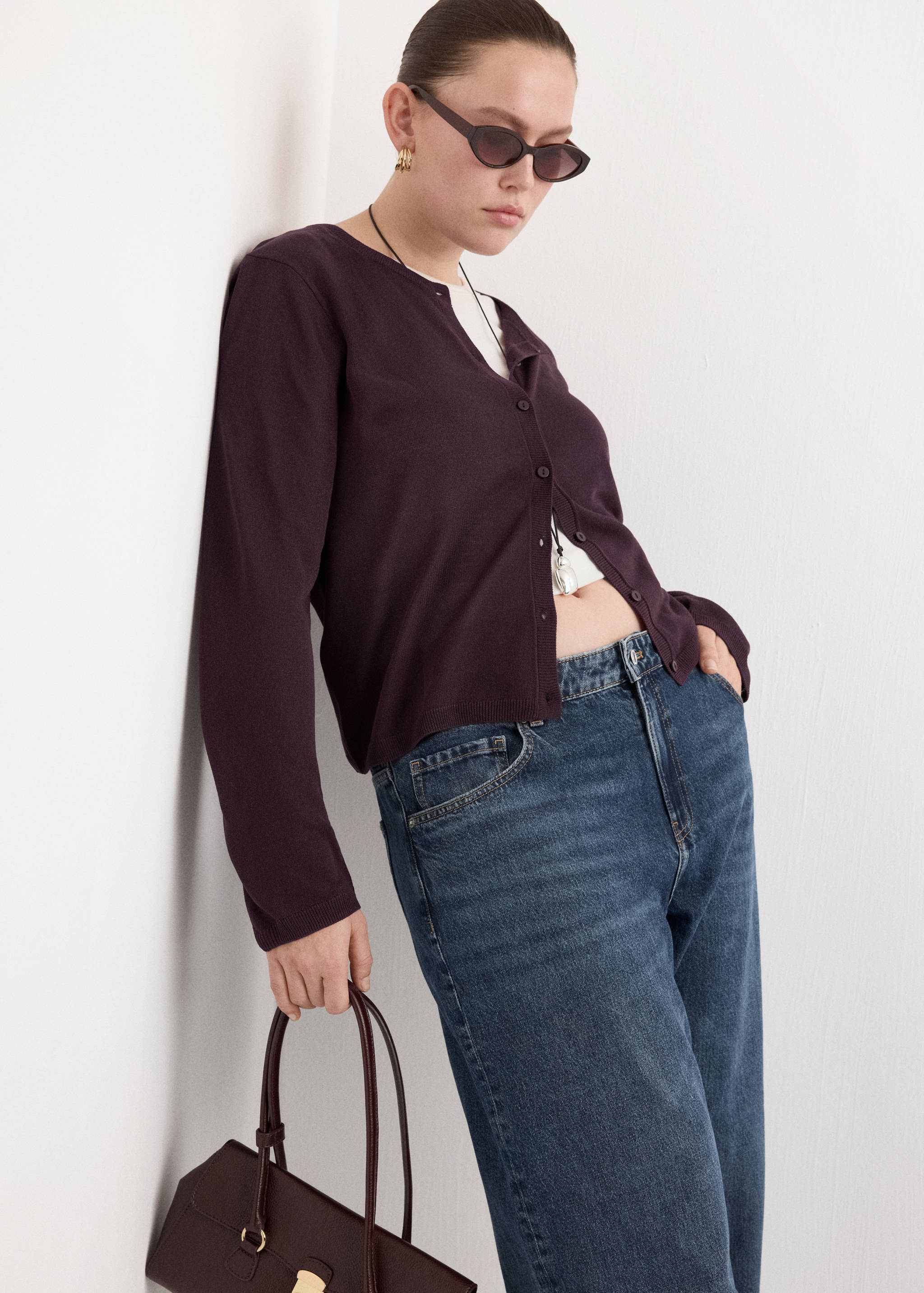 Plum purple button-down cardigan with a round neckline and long sleeves.