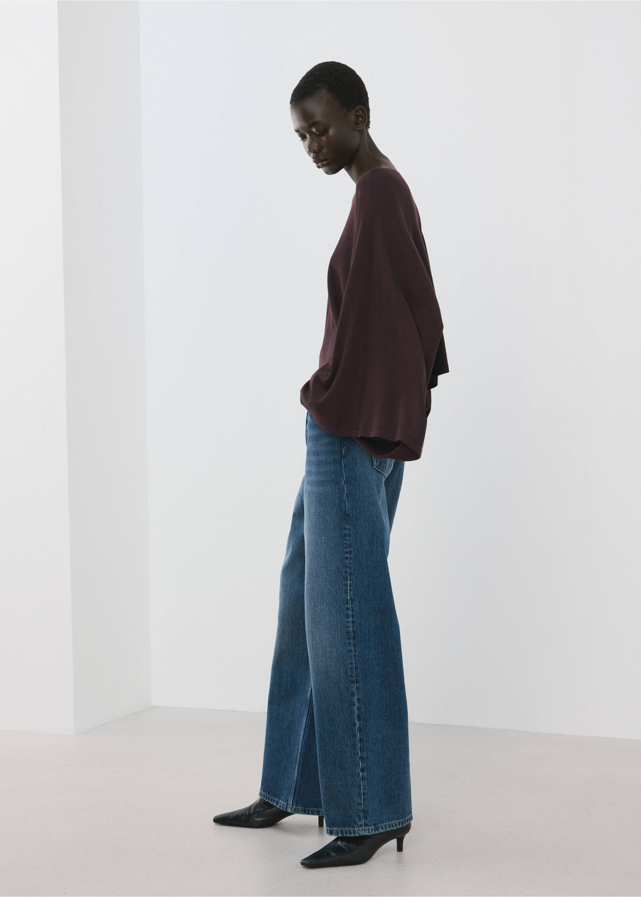 Burgundy cape with wide sleeves, worn with blue wide-leg trousers., Wine. Ref: 27075826-00.