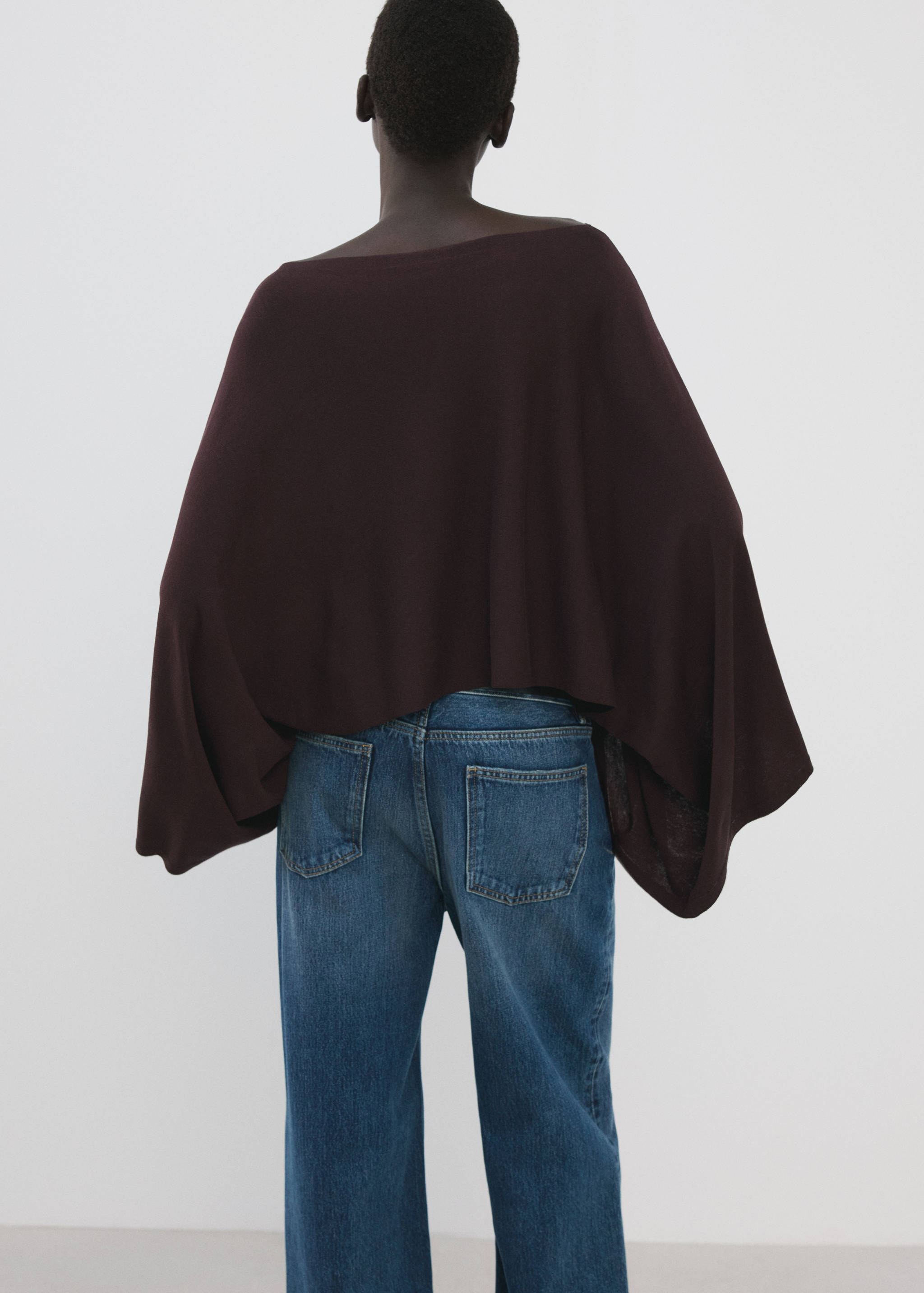 Dark burgundy cape with a wide boat neckline, back view.