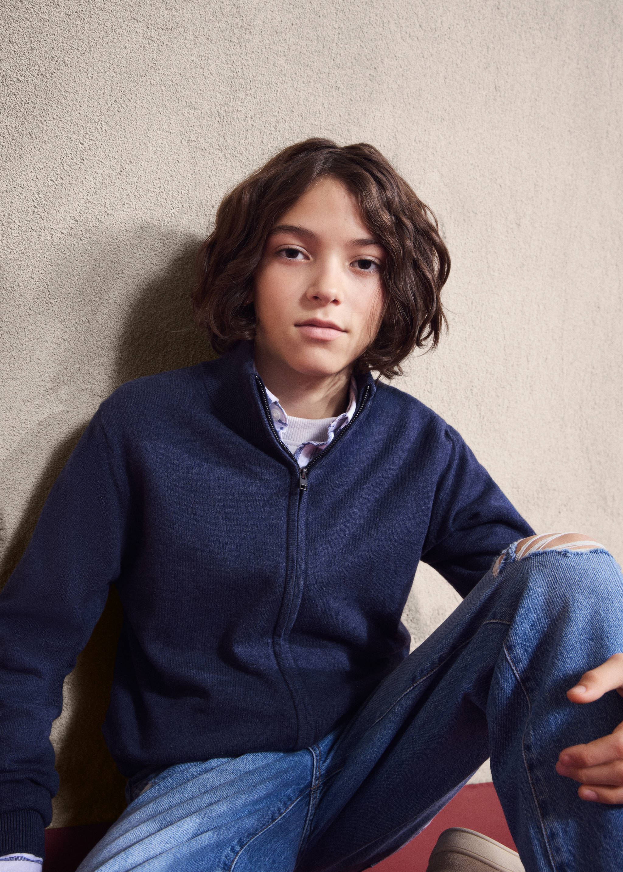 Navy blue zip-up knitted cardigan with a high collar worn by a child., Navy. Ref: 27081253-00.