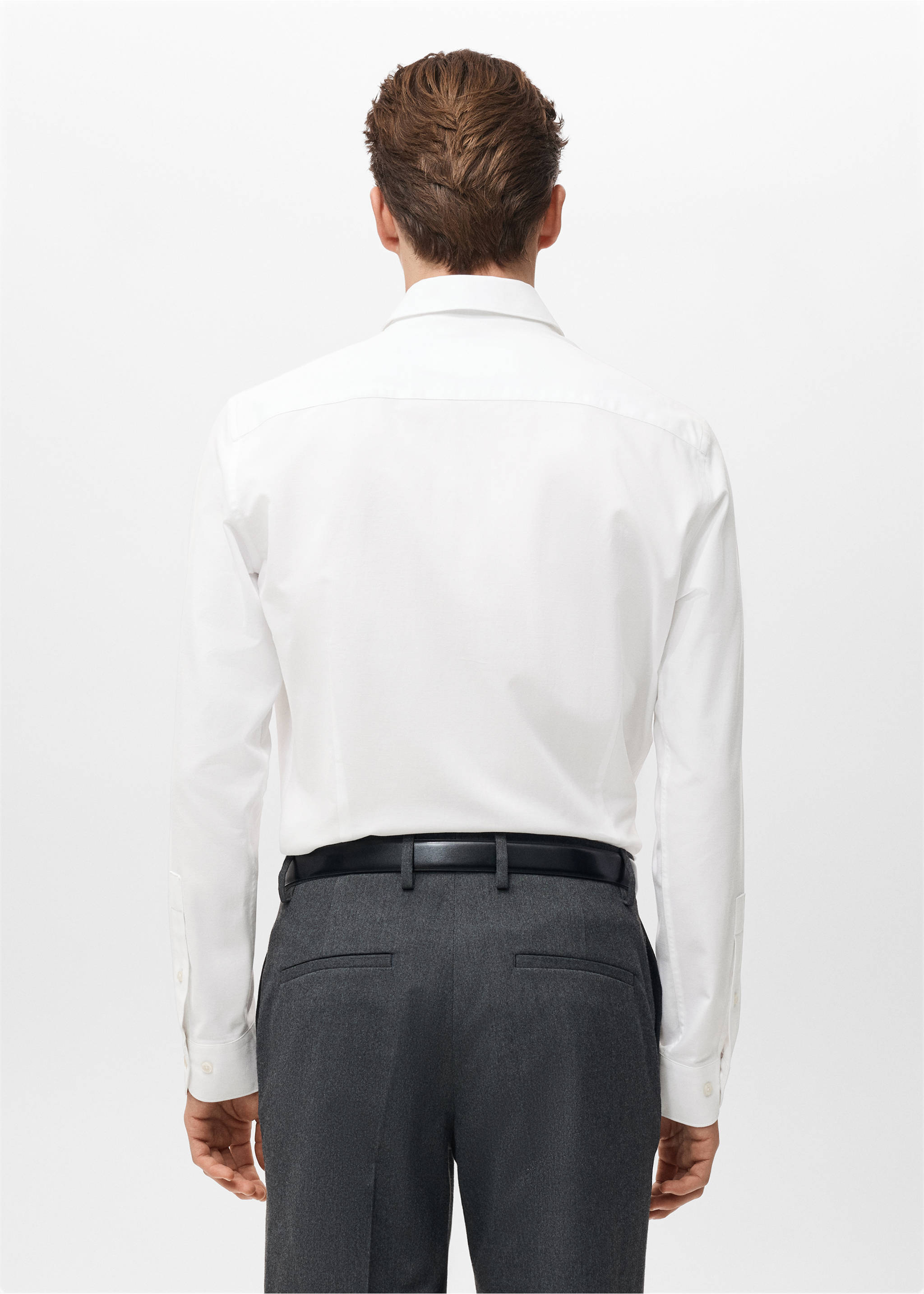 Back view of a white long-sleeved shirt tucked into dark trousers., White. Ref: 27081310-00.