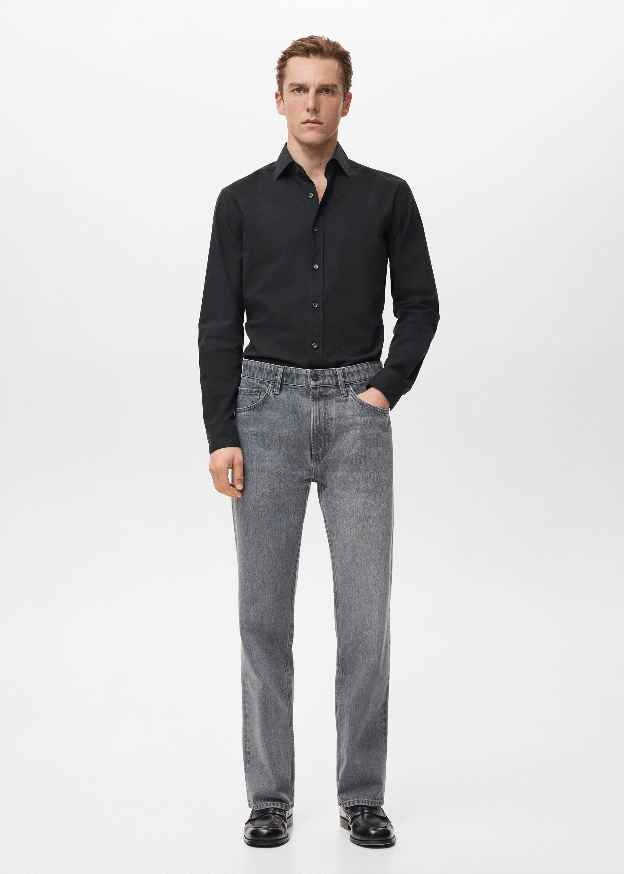Black long-sleeved shirt with classic collar and button fastening, worn with grey trousers., Black. Ref: 27081310-00.