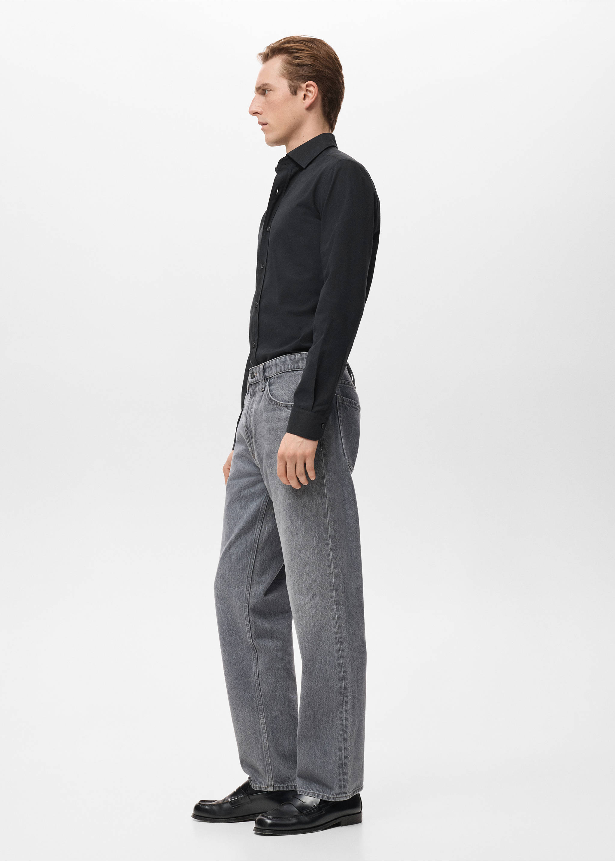 Black long-sleeved shirt with a classic collar, worn with grey denim trousers., Black. Ref: 27081310-00.