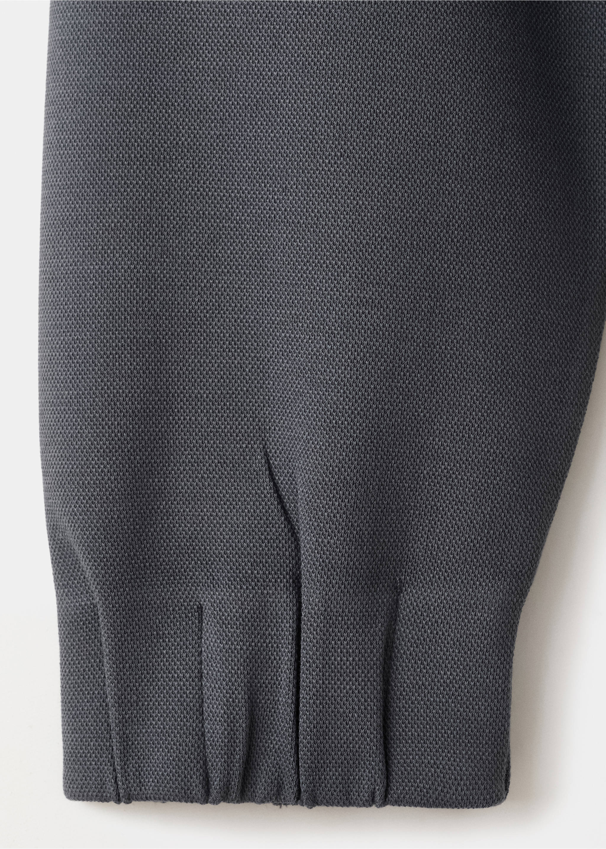 Dark grey sweatshirt fabric detail showing the textured knit and ribbed cuff., Blue. Ref: 27083315-00.