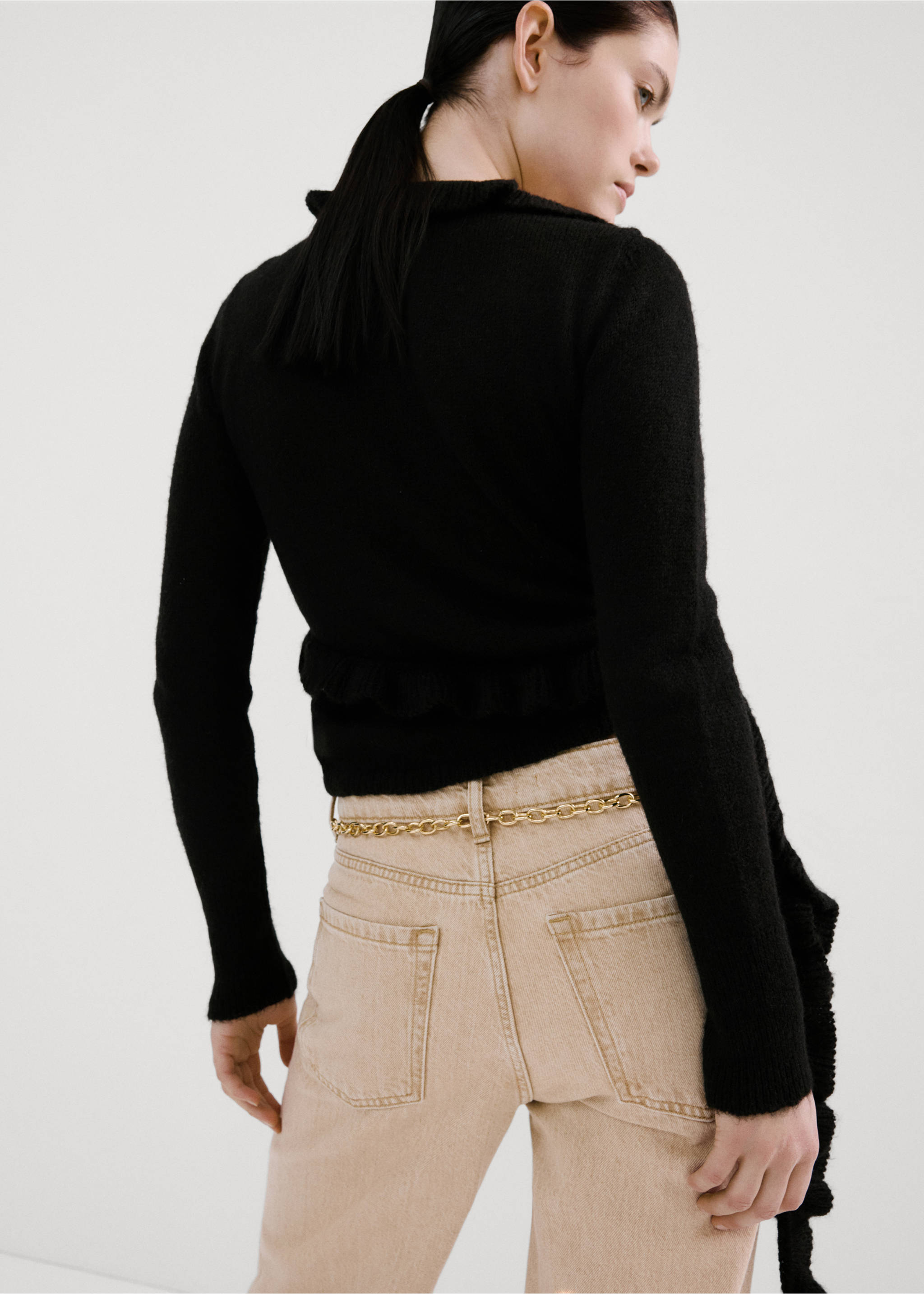 Black knit cardigan with ruffled details, back view, Charcoal. Ref: 27084097-00.