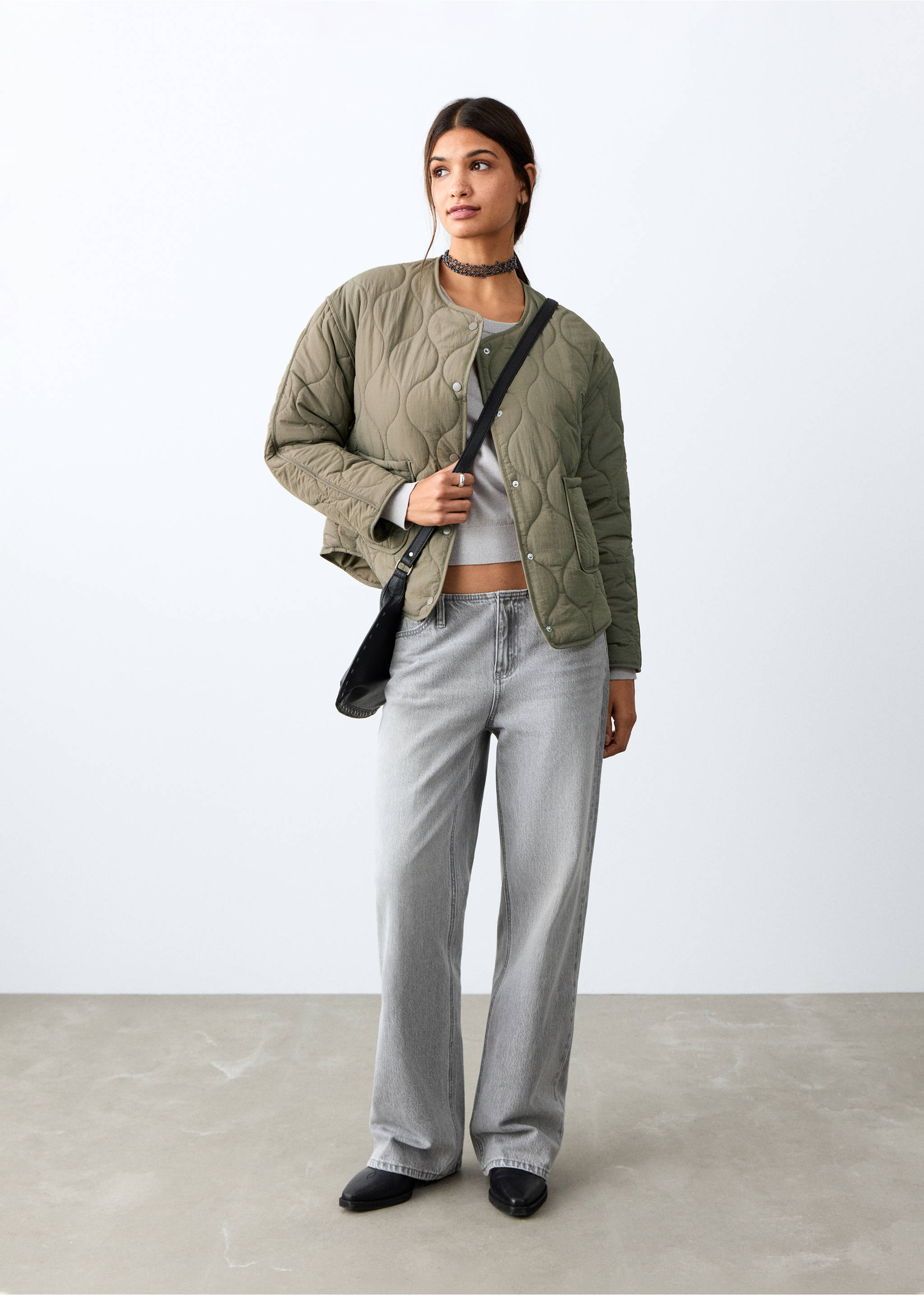 Olive green quilted parka with snap buttons and patch pockets, worn with grey trousers, Khaki. Ref: 27084432-00.
