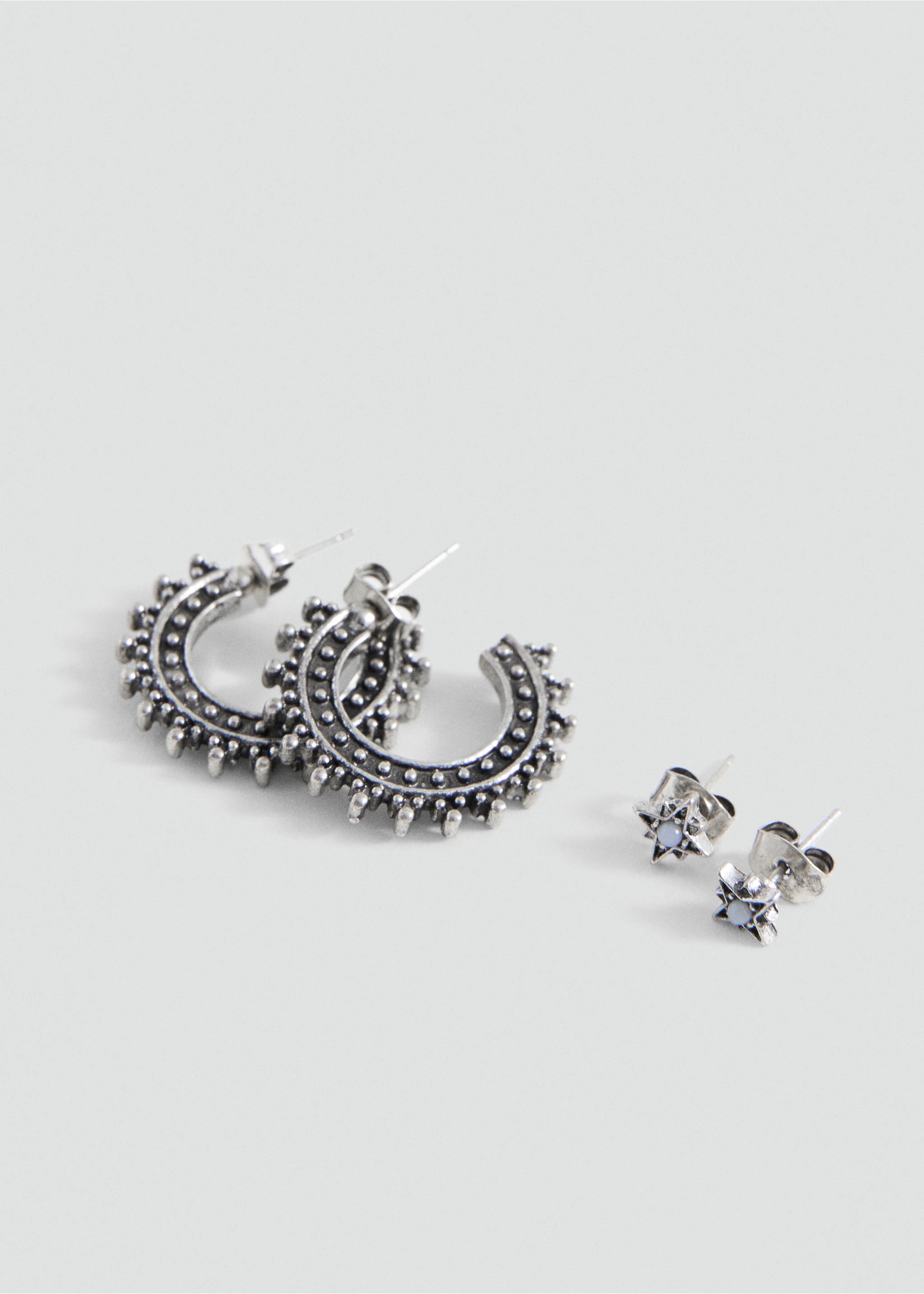 Silver-toned hoop and starburst stud earrings set with textured detailing., Silver. Ref: 27085160-00.