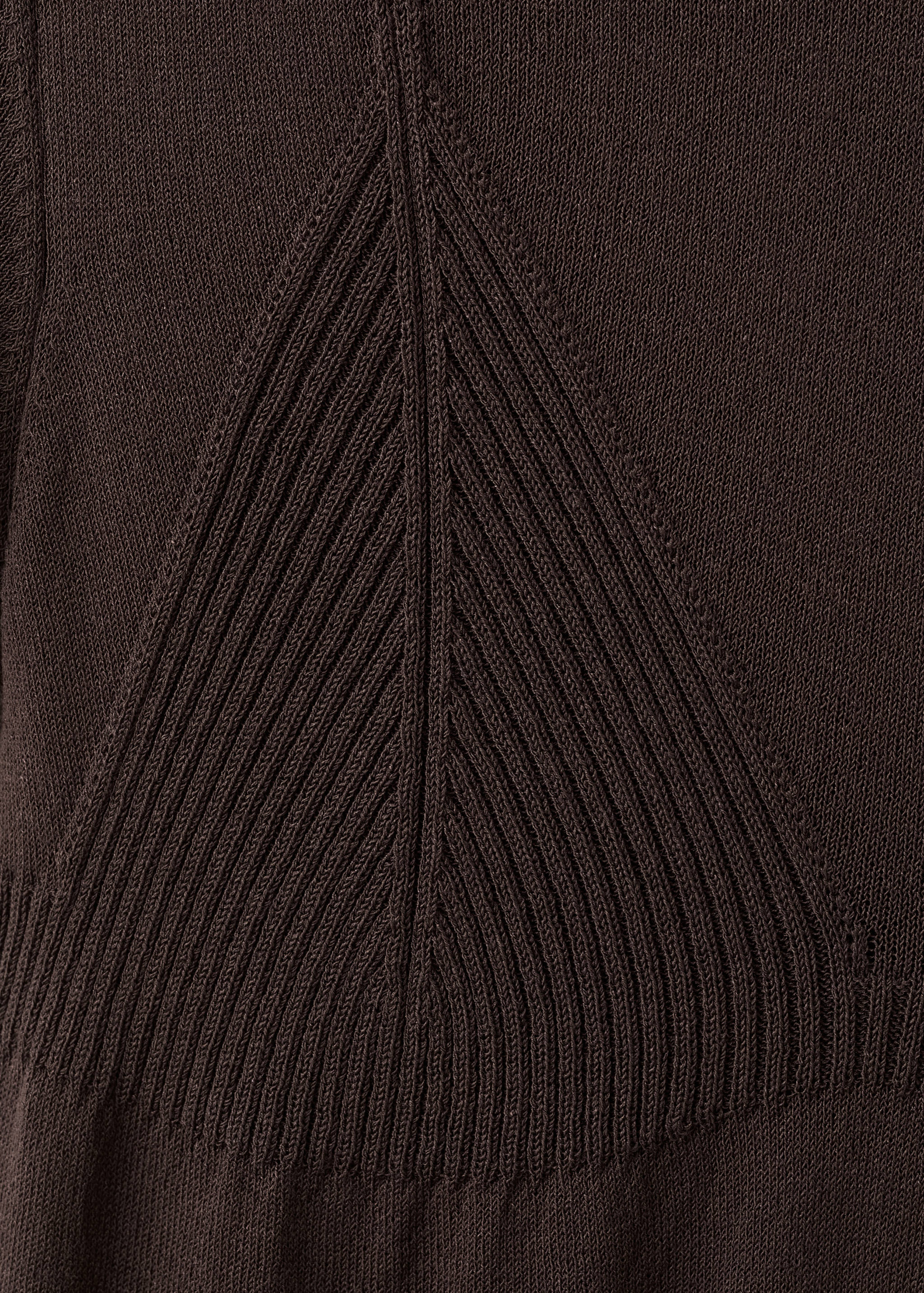 Close-up of the dark brown knit texture and chevron ribbing on a jersey.
