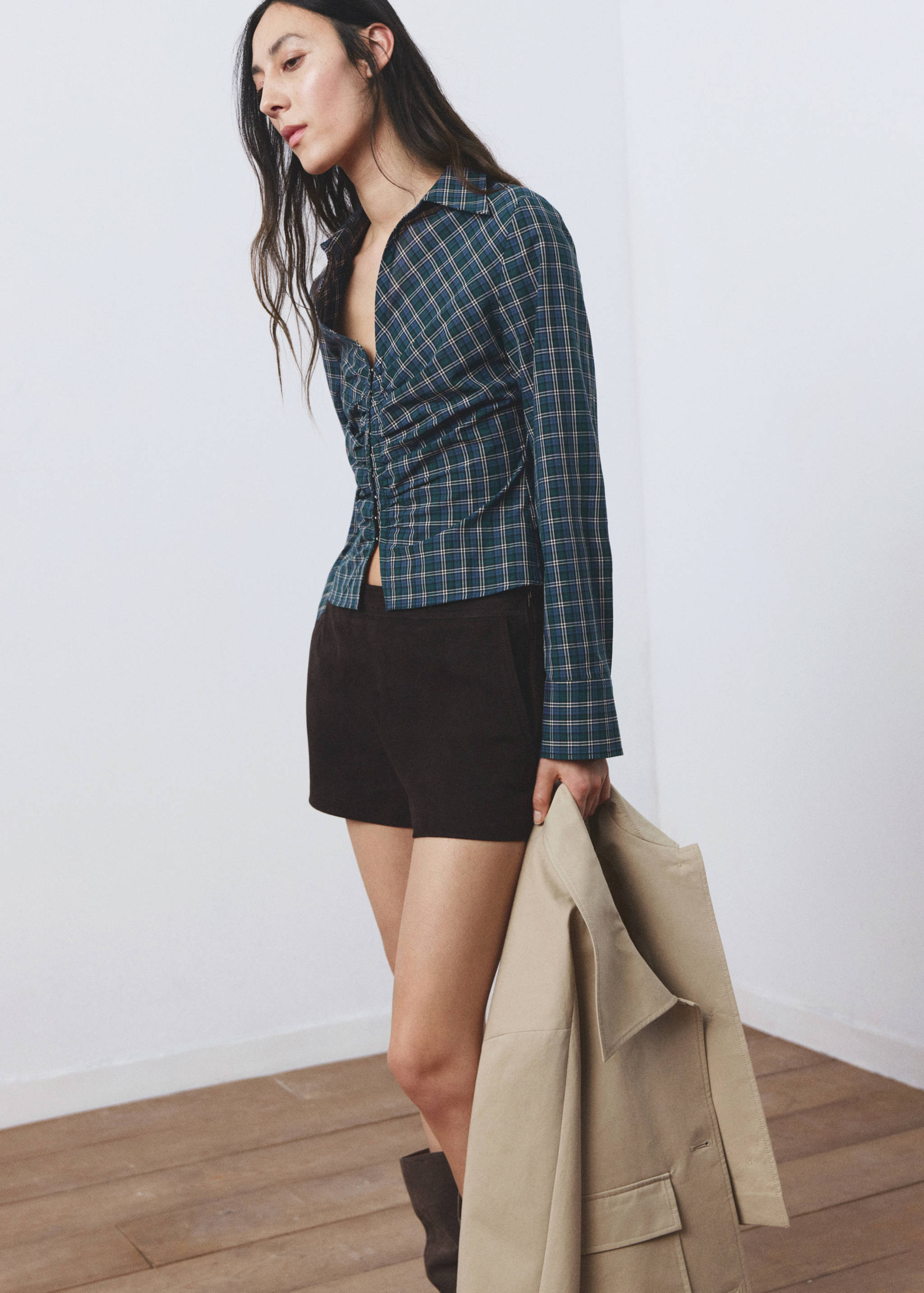 Green plaid blouse with a pointed collar and ruched button-up front.