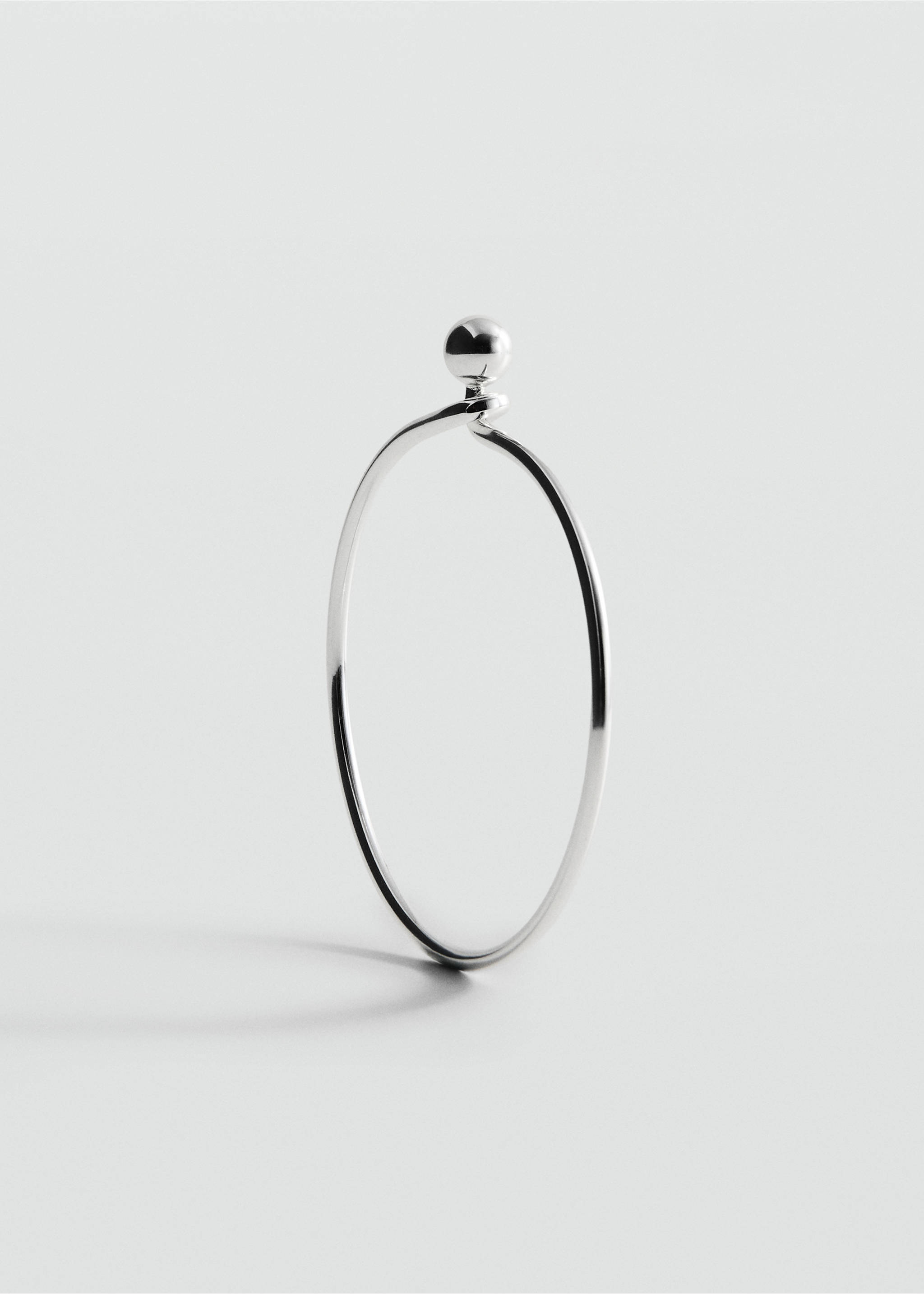 Silver-toned metal bangle bracelet with a spherical bead closure detail., Silver. Ref: 27087788-00.
