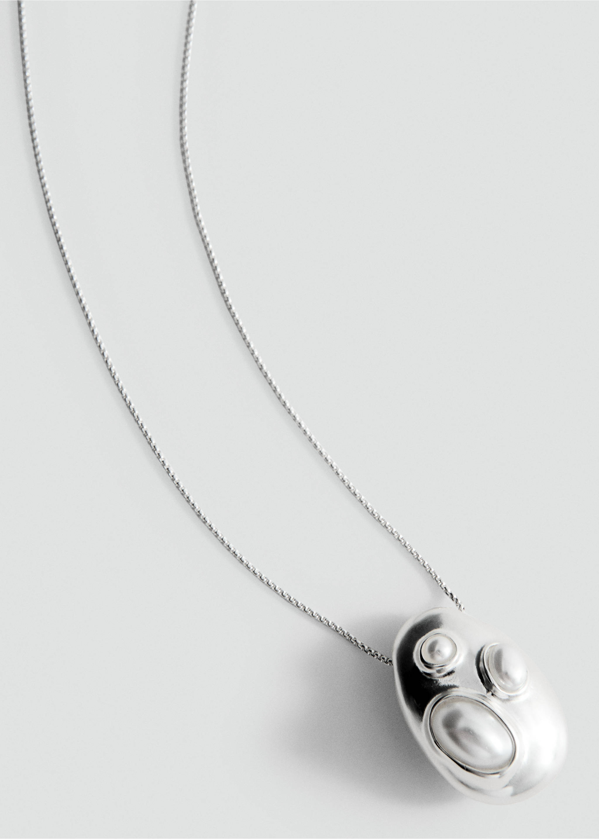 Silver-toned necklace with a rounded irregular pendant and white stone details., Silver. Ref: 27087796-00.