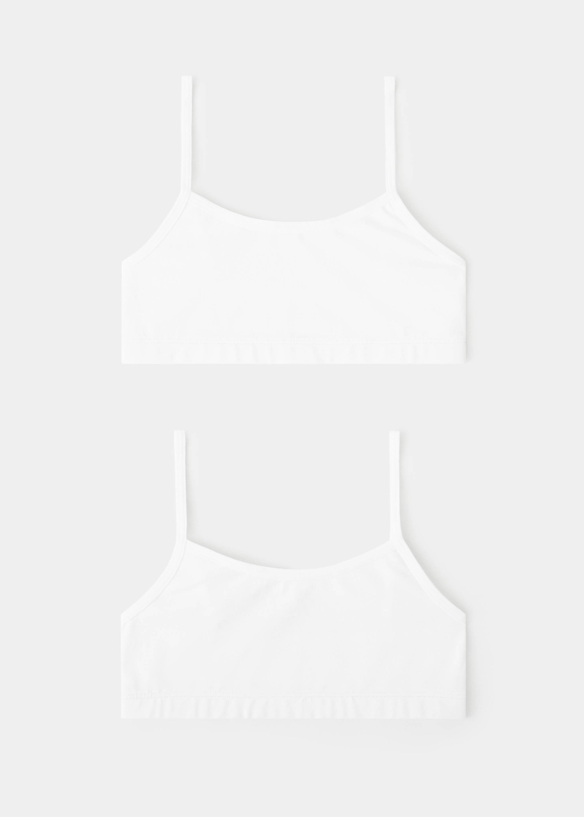 Set of two white bralettes with thin shoulder straps and scoop necklines, shown front and back.