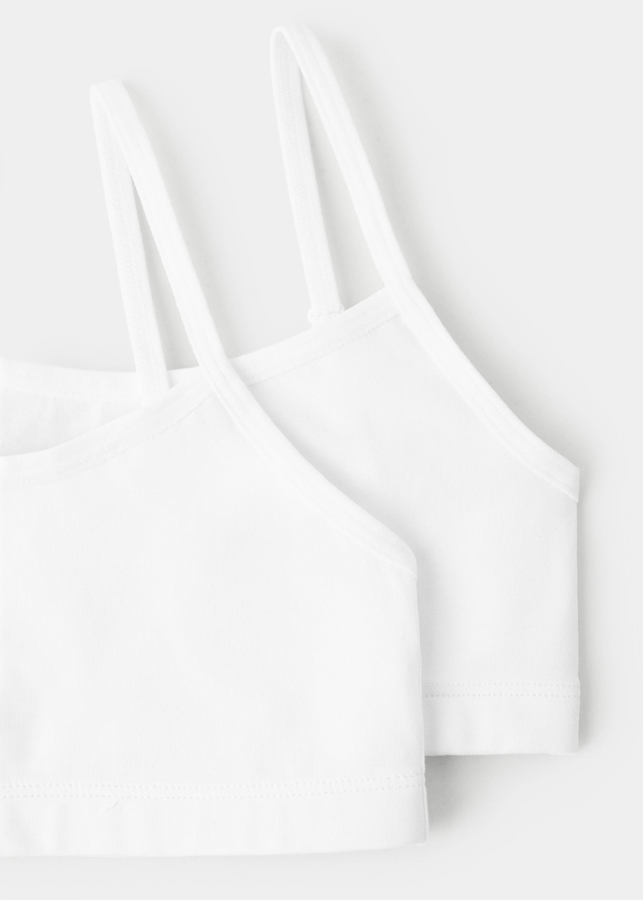 White cotton bralette detail with double thin shoulder straps.