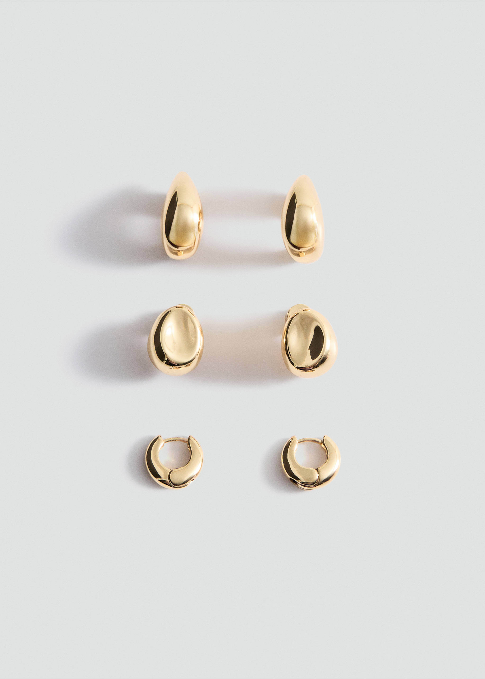 Set of three pairs of shiny gold-finish earrings in teardrop, organic and huggie hoop designs., Gold. Ref: 27091277-00.