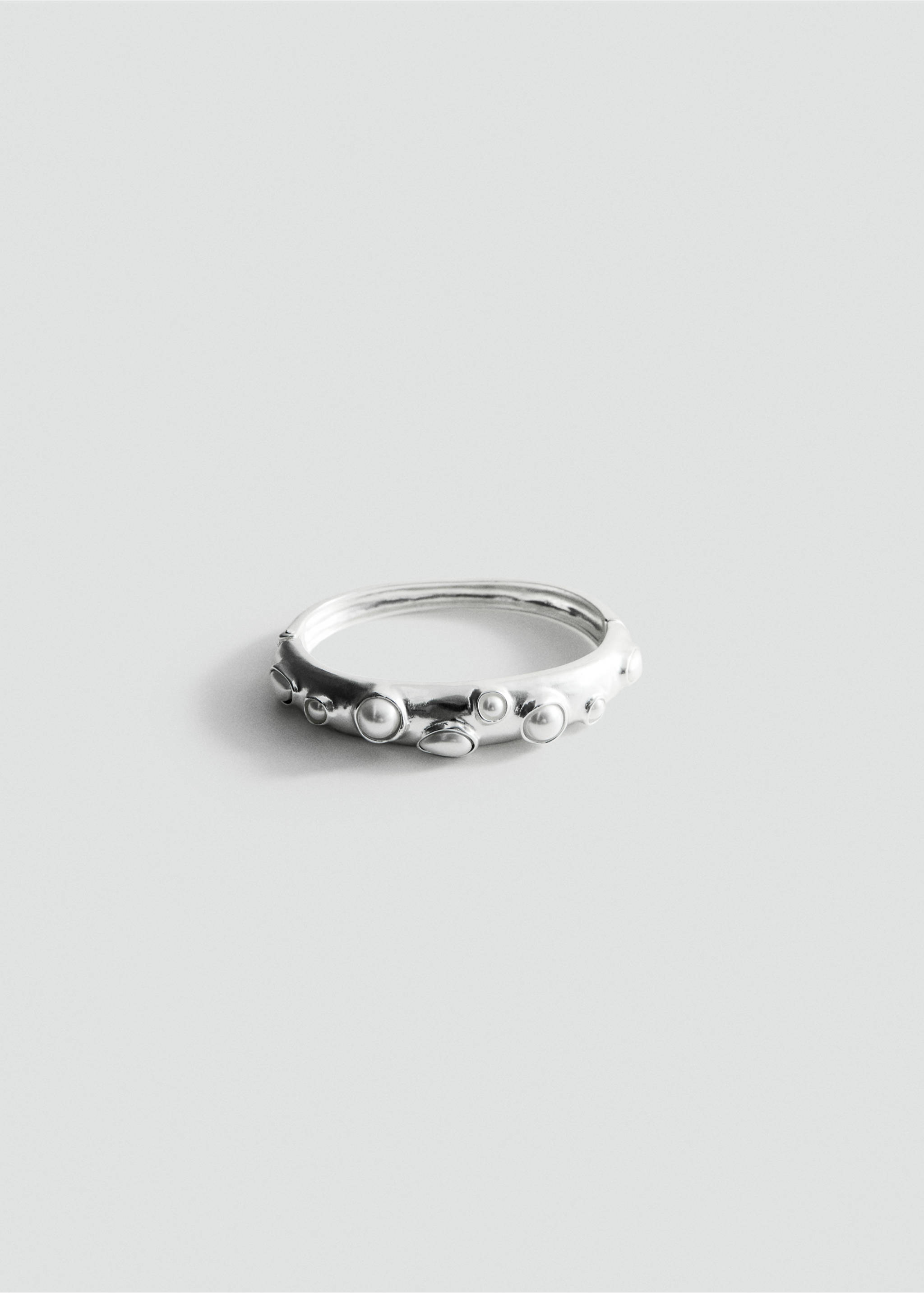Silver-toned rigid bangle bracelet with embedded bead details., Silver. Ref: 27097796-00.