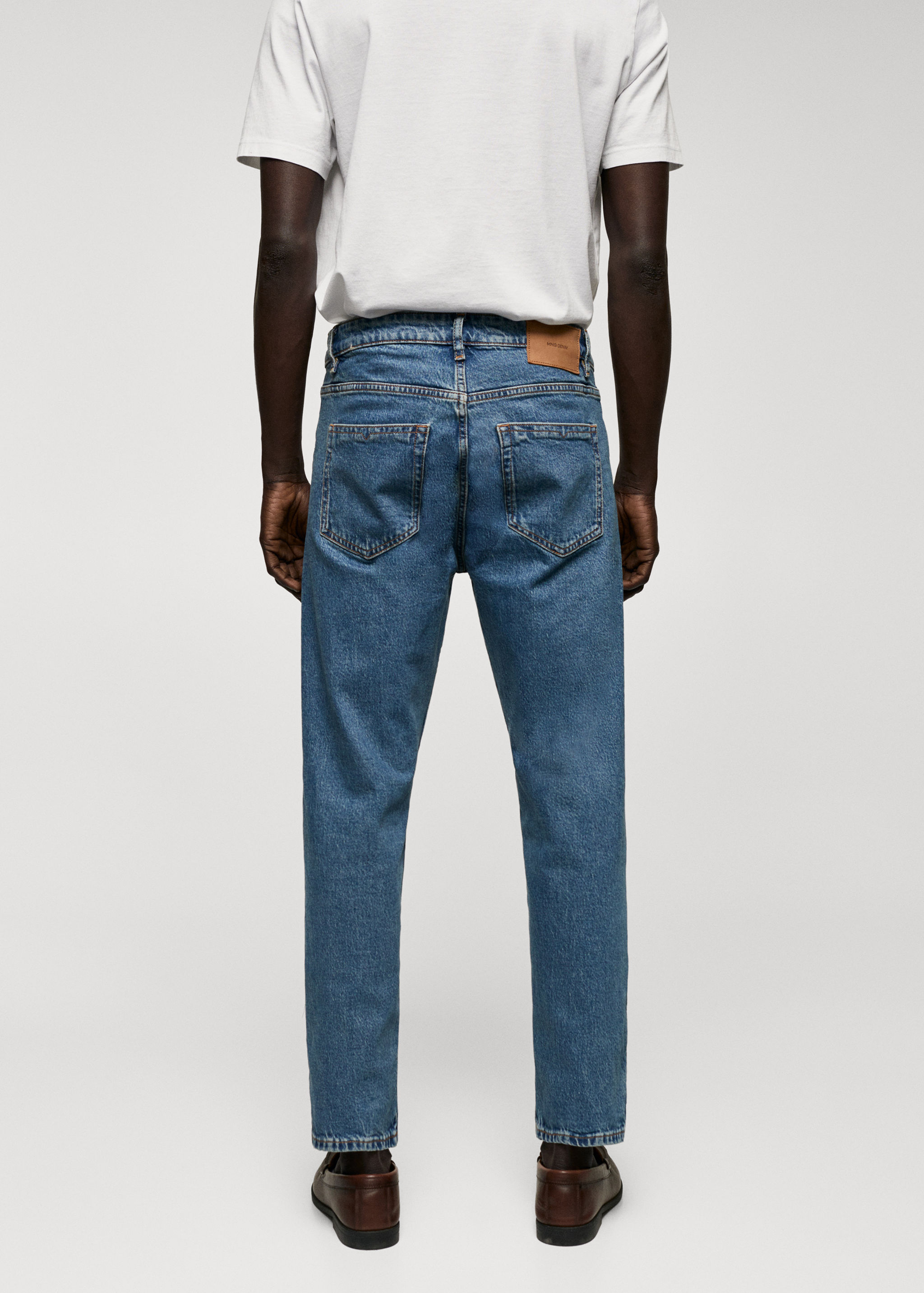 Jeans Ben tapered e cropped - Verso do artigo