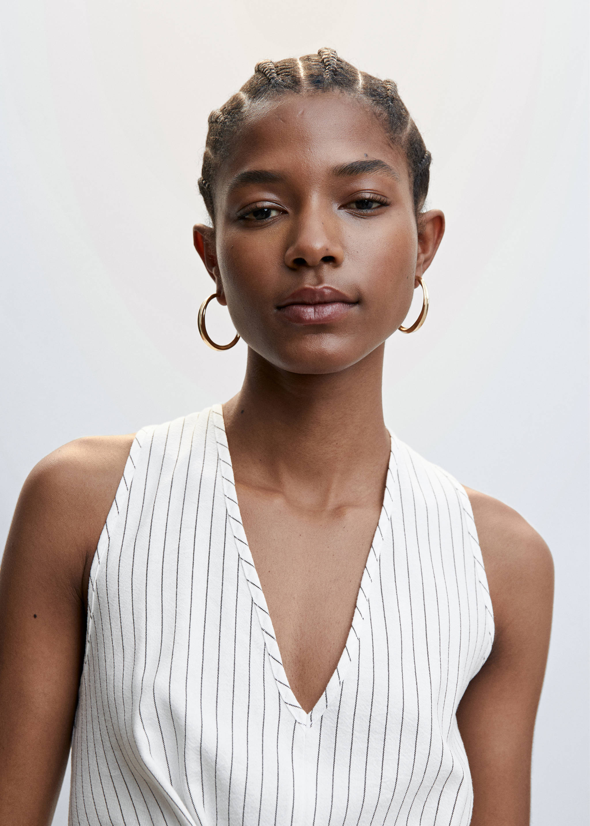 Gestreifter Jumpsuit mit Knotendetail - Detail des Artikels 1