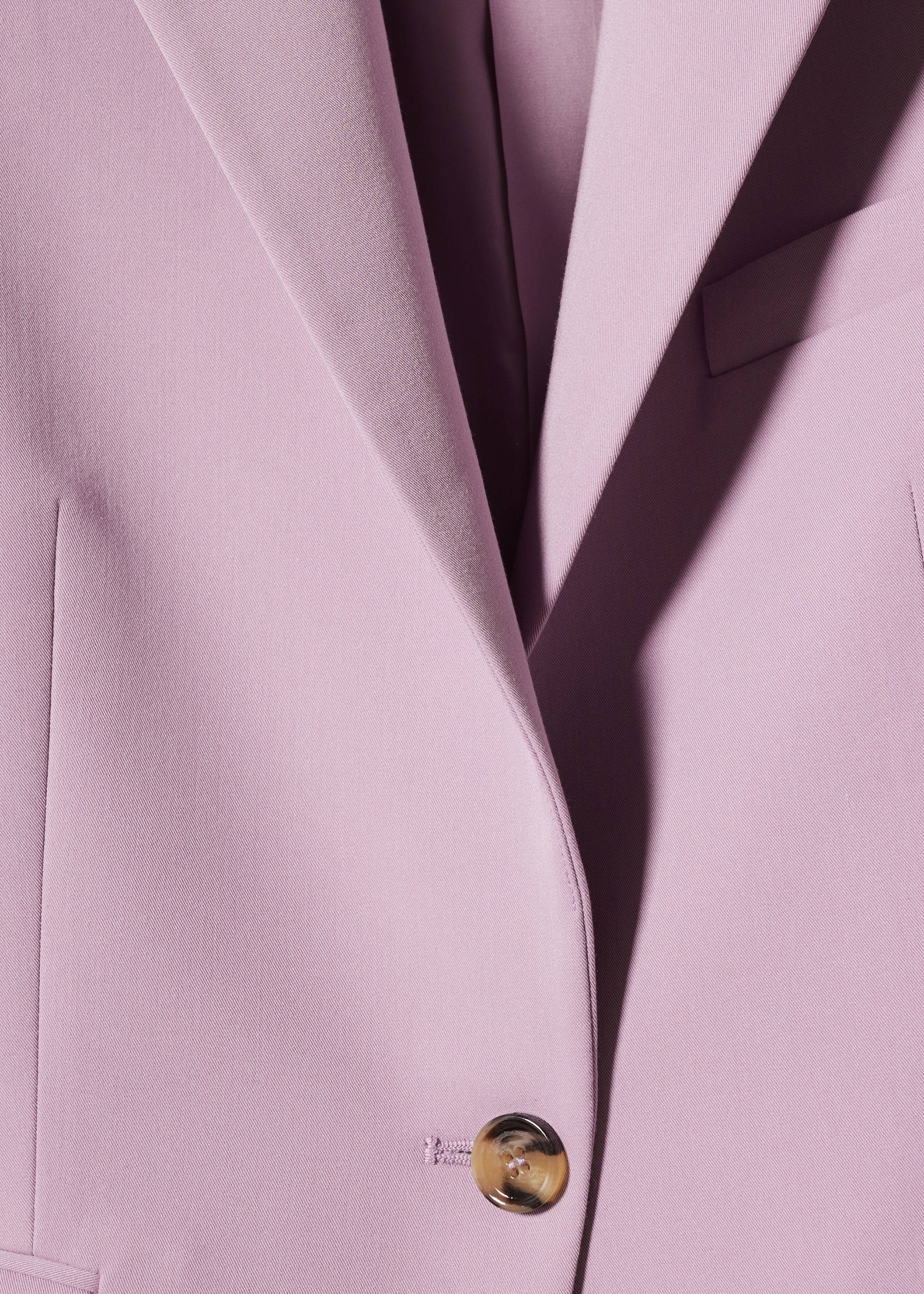 Colbert met knoop - Detail van het artikel 8