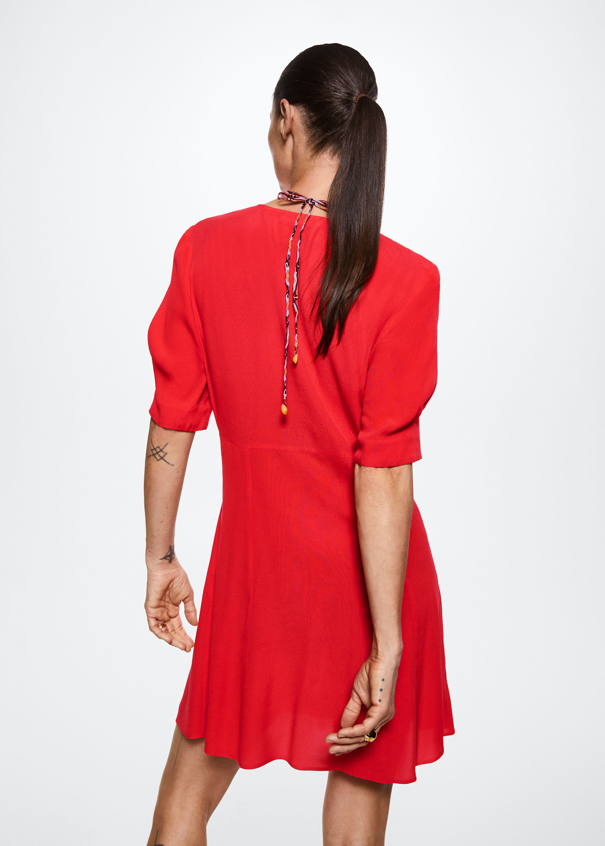 Vestit detall frunzit - Revers de l'article