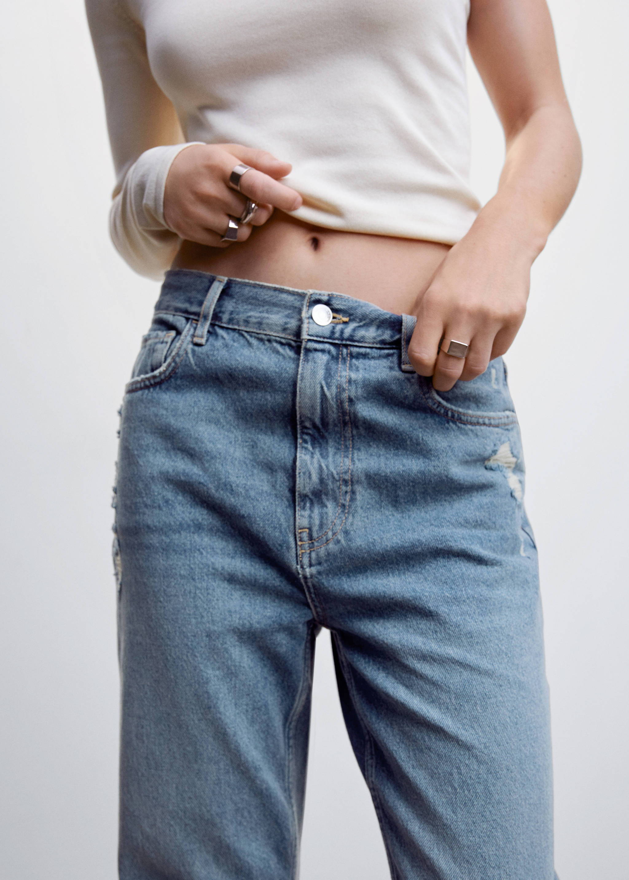 Ripped high-rise straight jeans - Details of the article 1