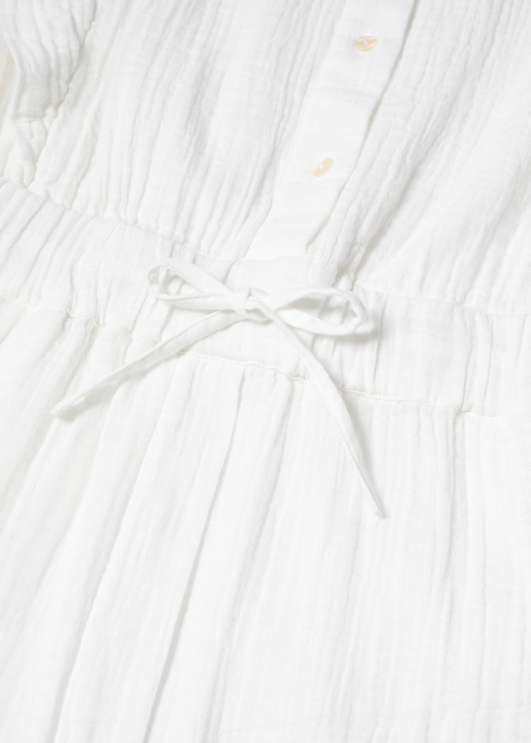 Textured jumpsuit with button - Details of the article 8