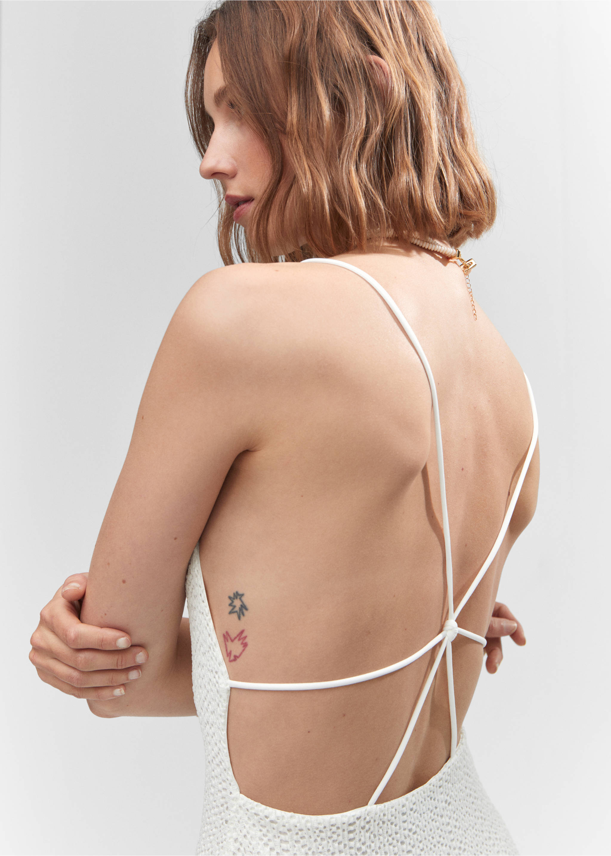 Cross-back textured dress - Details of the article 1, Off White. Ref: 57001142-00.