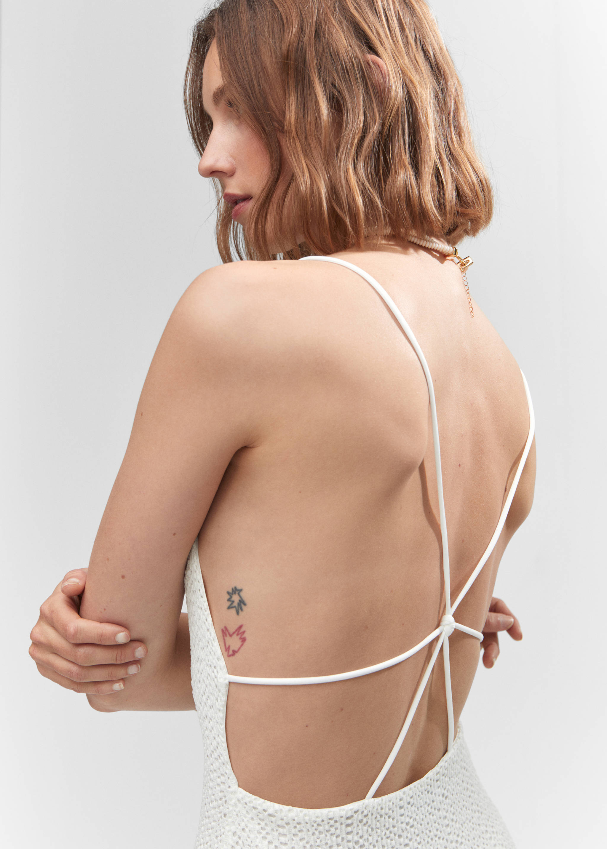 Cross-back textured dress - Details of the article 1