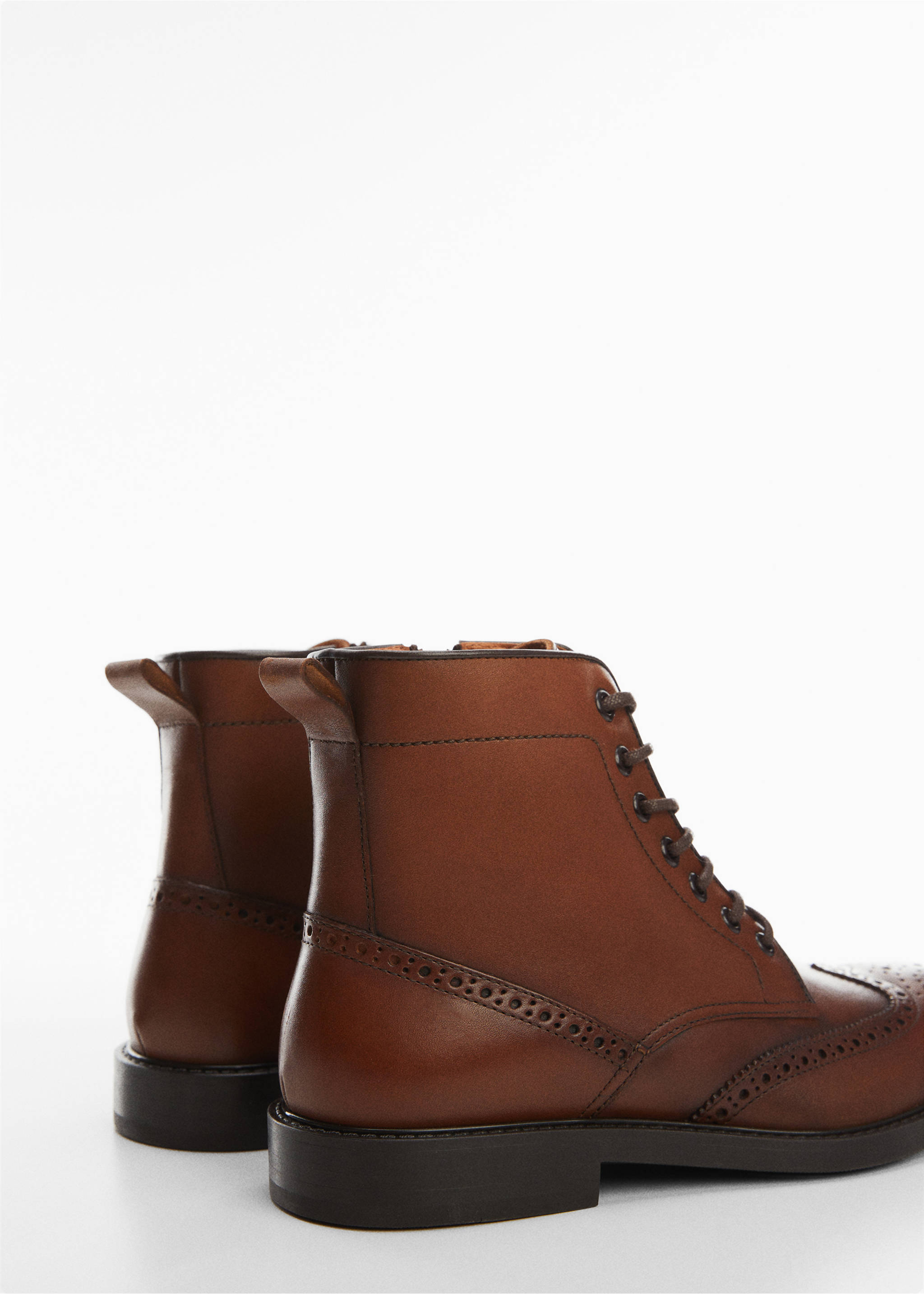 Die-cut leather ankle boots - Details of the article 1, Leather. Ref: 57006031-00.