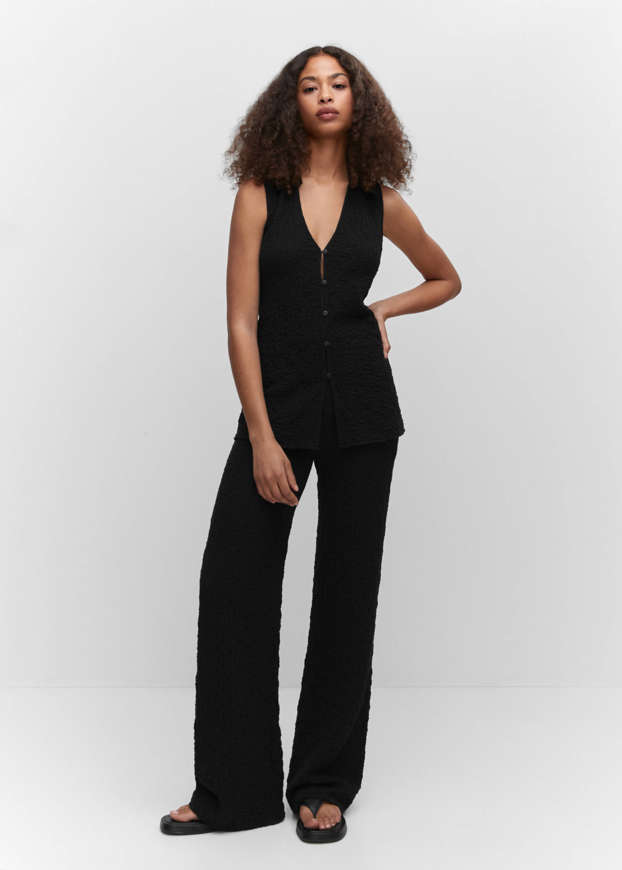 Getextureerd gilet met polokraag - Overzichtstekening