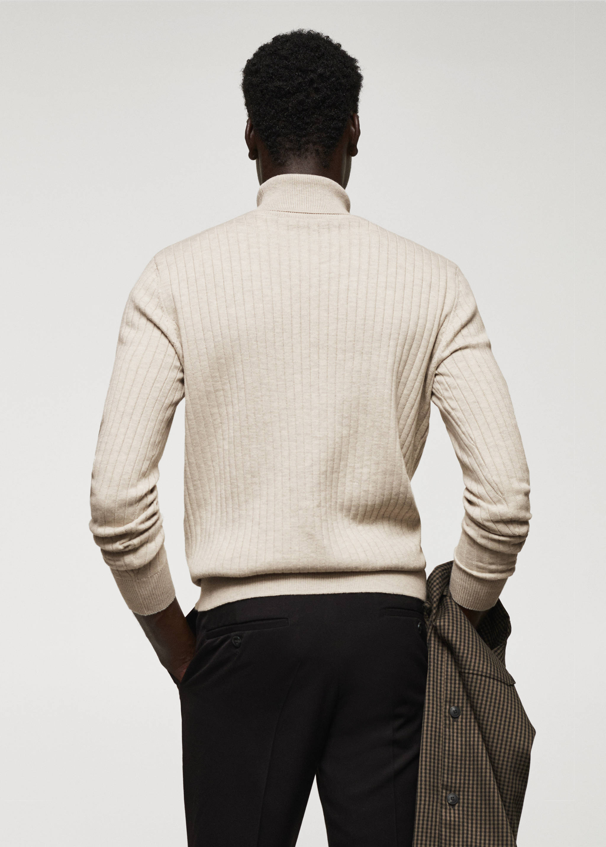 Rolled neck cable sweater - Reverse of the article