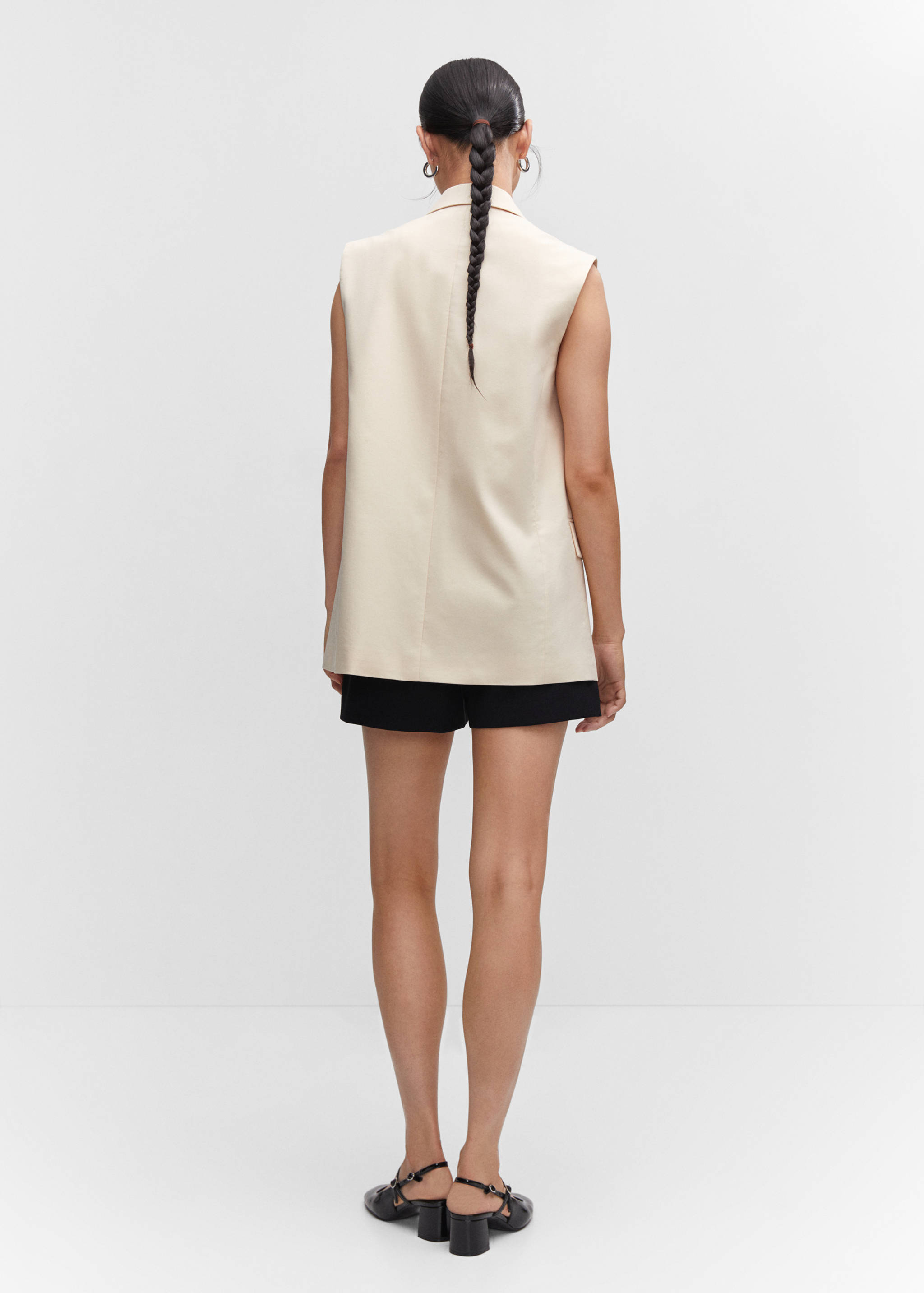 Long vest with pockets - Reverse of the article