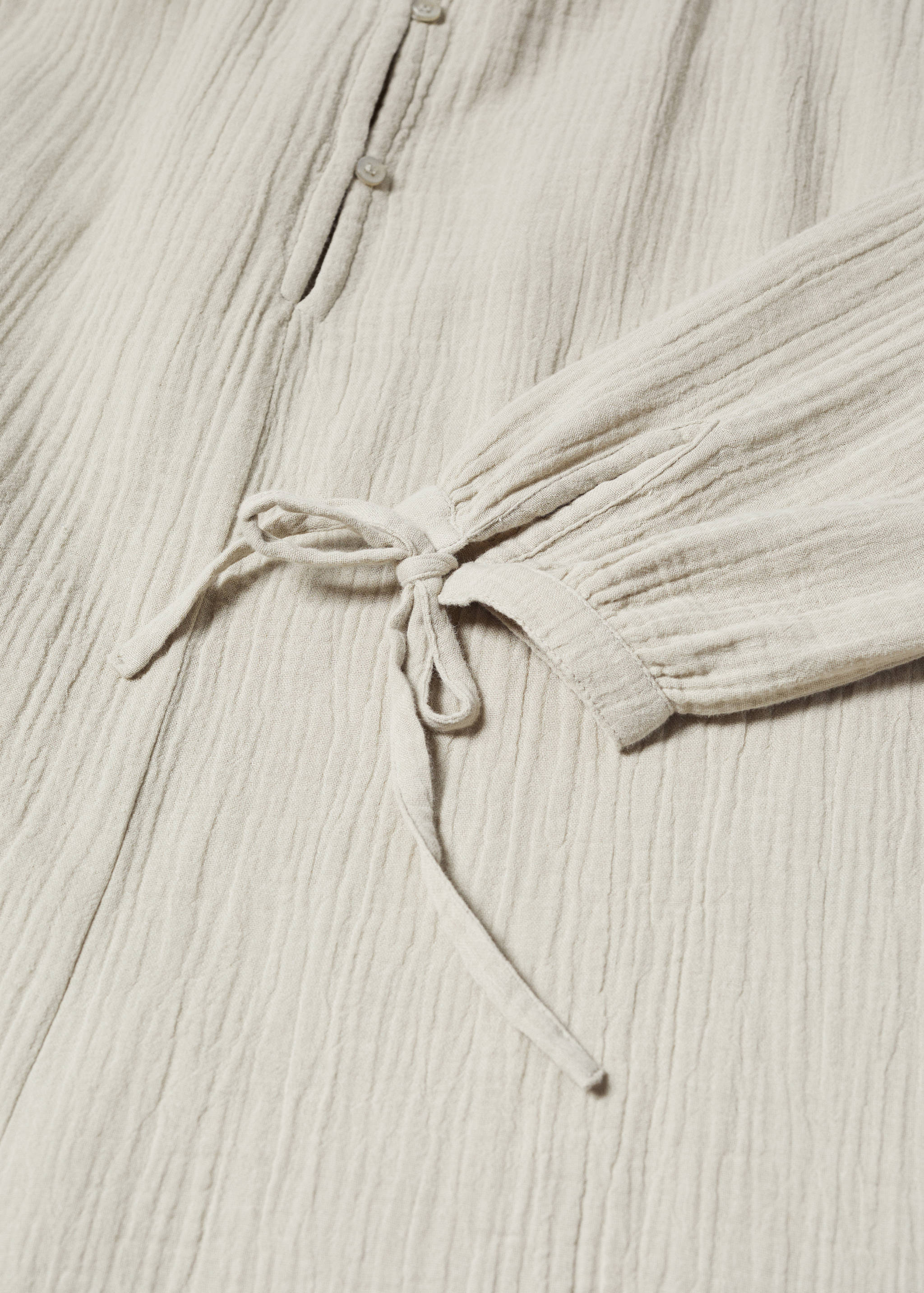 Short jumpsuit with buttons - Details of the article 8