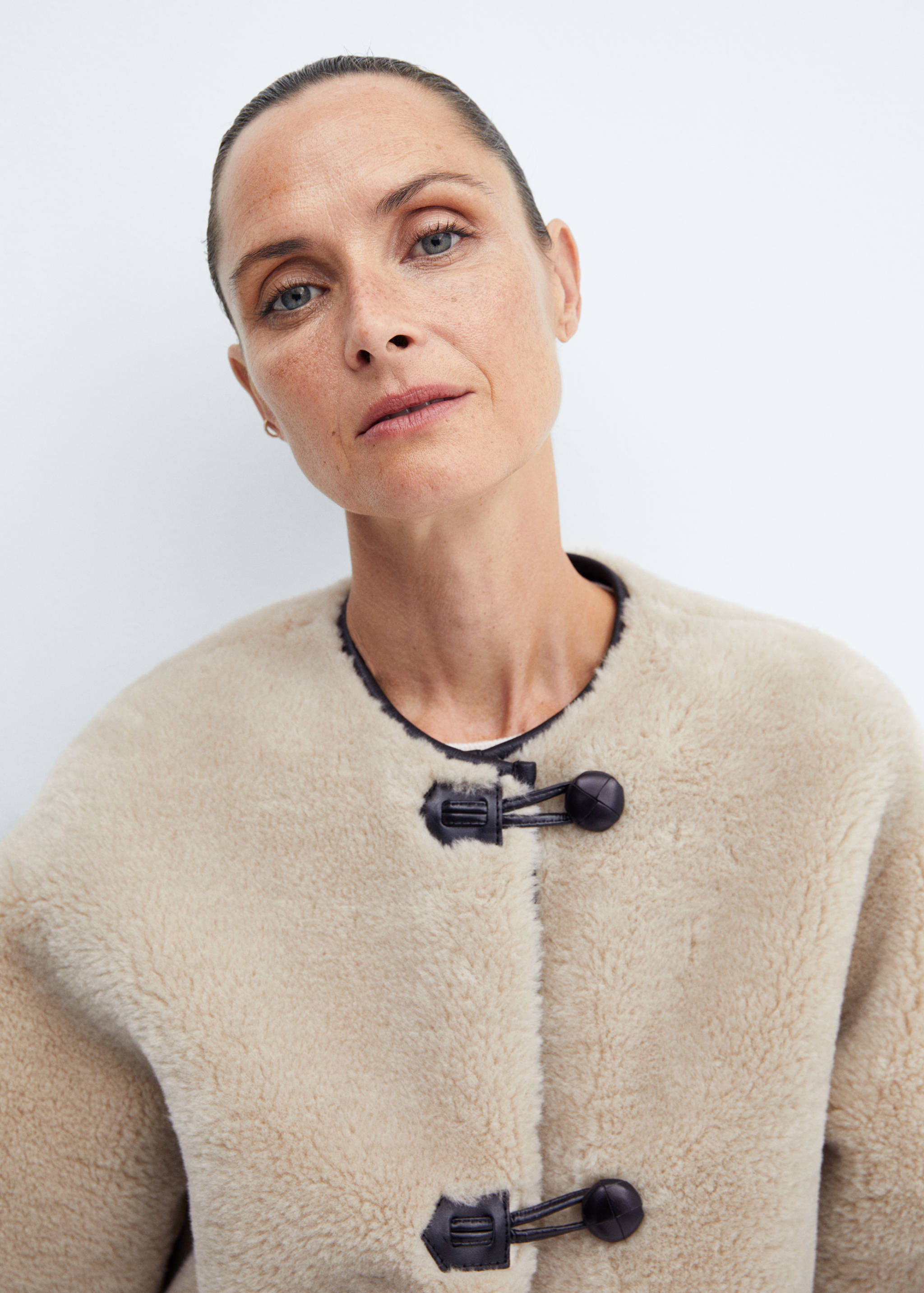 Fur-effect coat with appliqués - Details of the article 1