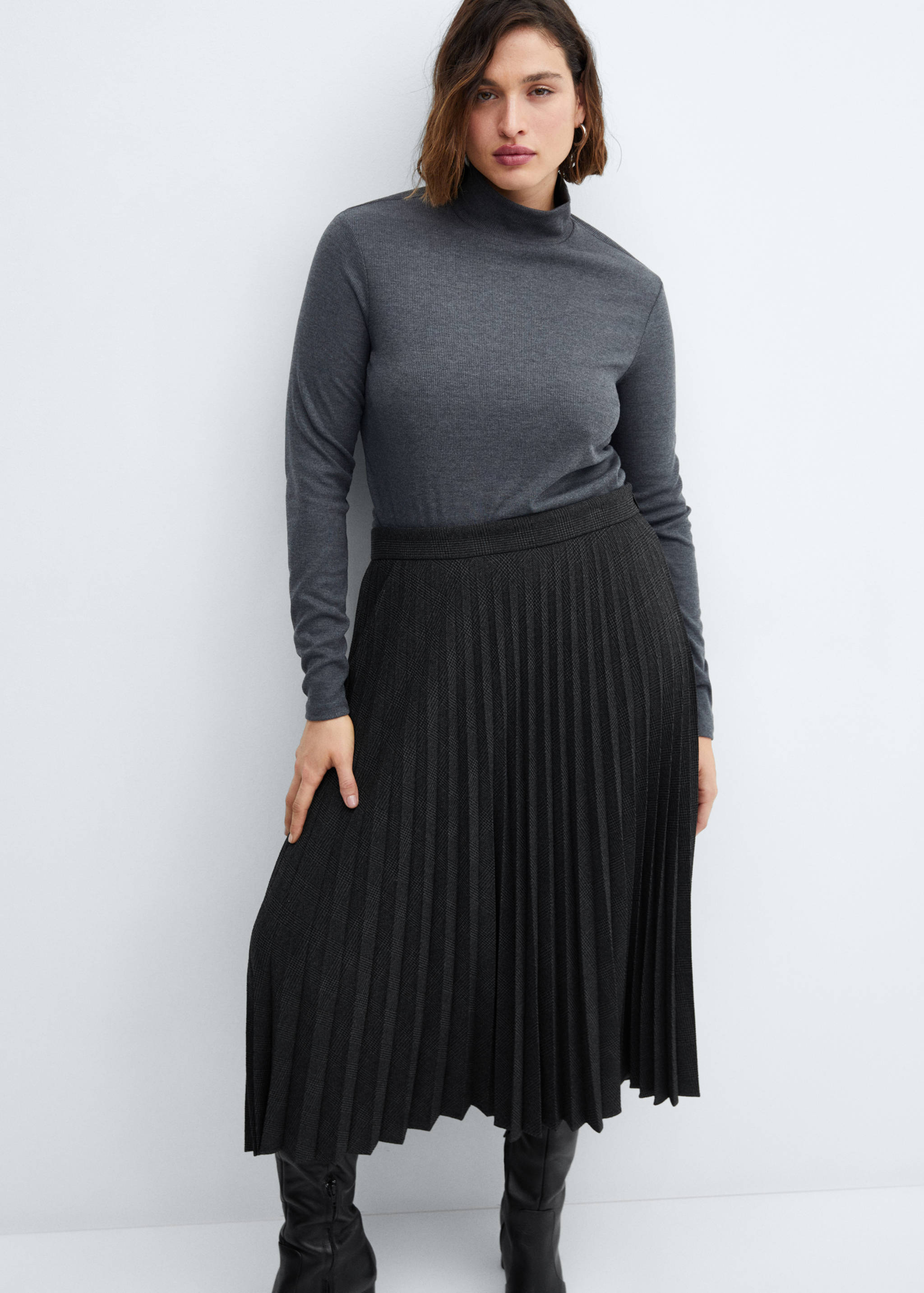 Geruite plissérok - Detail van het artikel 4