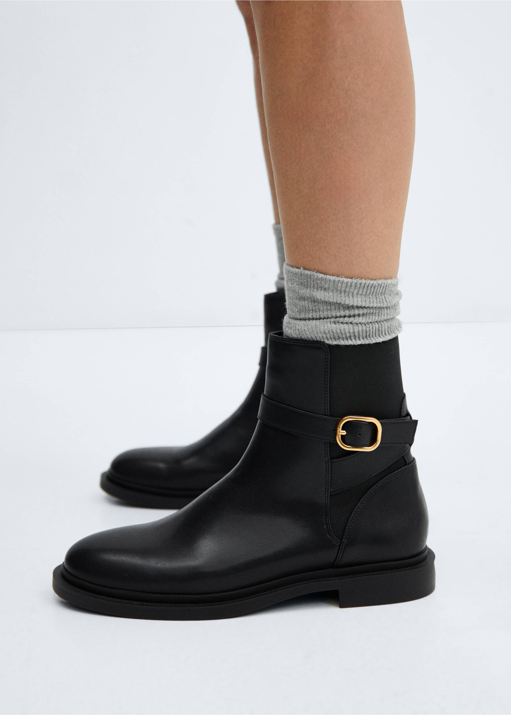 Ankle boots with elastic panel and buckle - Details of the article 9, Black. Ref: 57065971-00.