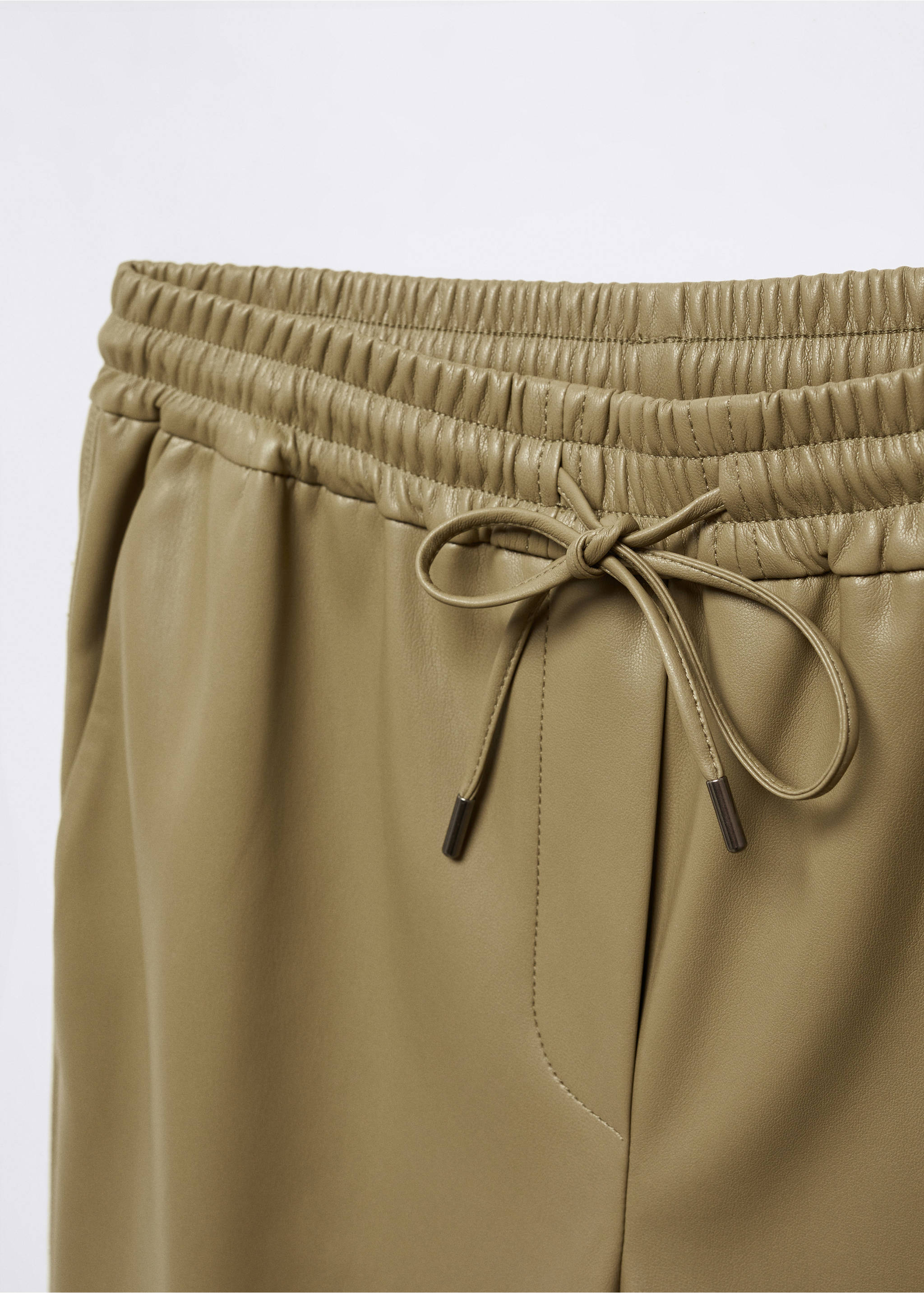 Faux-leather trousers with elastic waist - Details of the article 8, Green. Ref: 57076712-00.